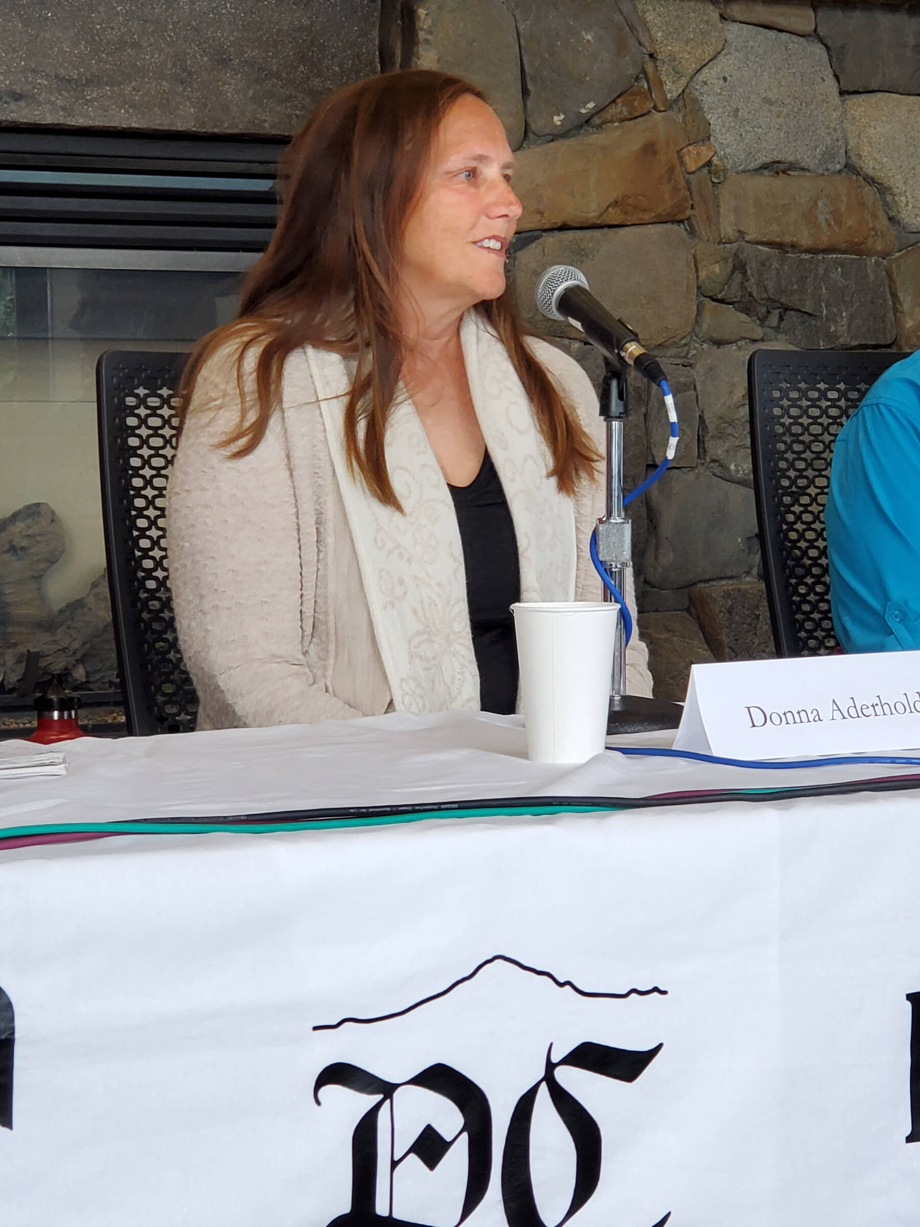 Homer city council member and incumbent candidate Donna Aderhold gives her opening statement during a forum held on Thursday, Aug. 29, 2024, in the Homer Public Library Fireplace Lounge in Homer, Alaska. (Delcenia Cosman/Homer News)