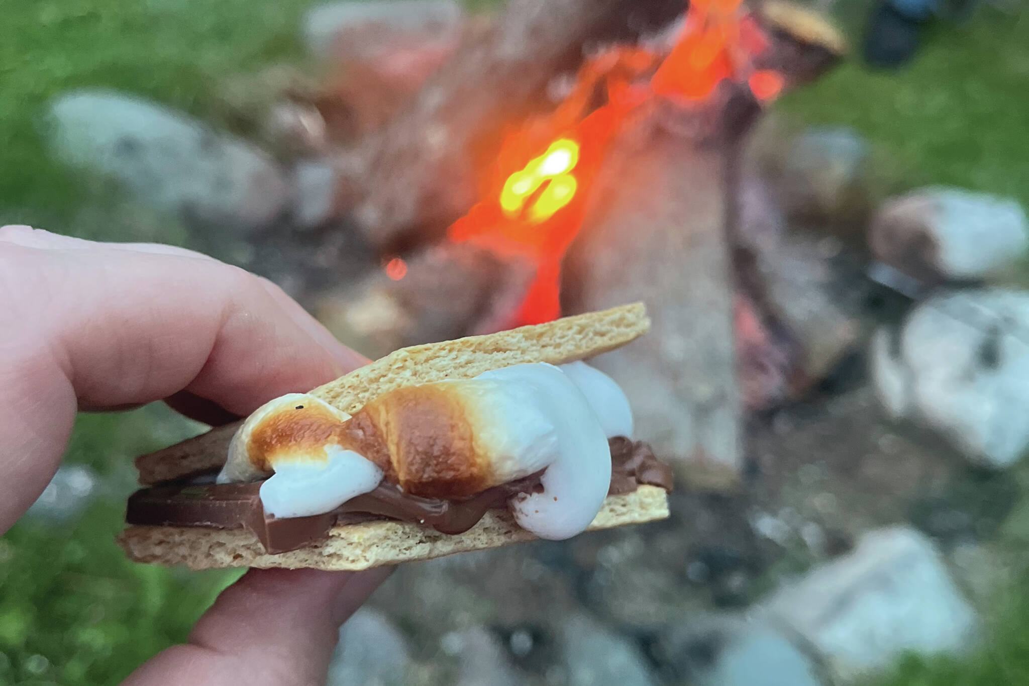 Rev. Meredith Harber enjoys a s’more on a fall day in Alaska. (Photo by Meredith Harber/courtesy)