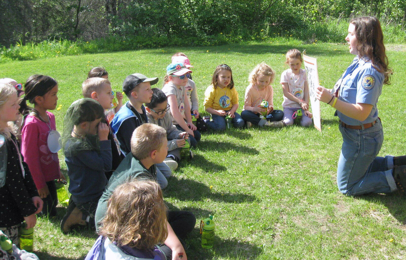 Rowan Yorkston explains the importance of the different habitats on the Kenai Peninsula to “Critter Camp” campers. (Photo provided by refuge)