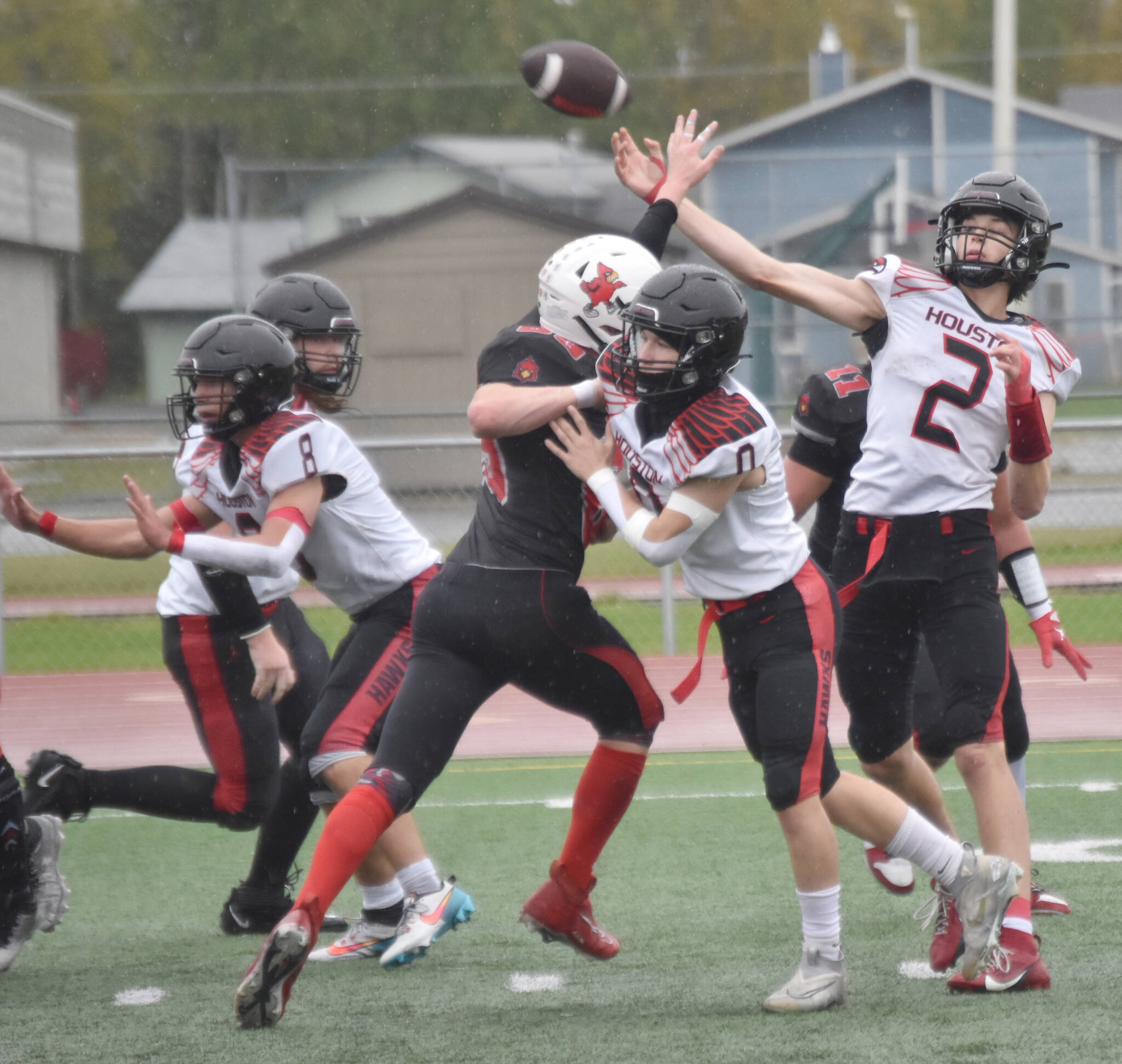 Houston’s Blake Baskett cuts loose a pass Saturday, Sept. 14, 2024, at Ed Hollier Field at Kenai Central High School in Kenai, Alaska. (Photo by Jeff Helminiak/Peninsula Clarion)