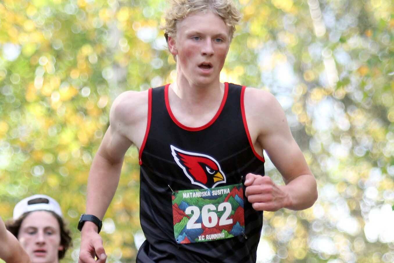 Kenai Central's Chase Laker clears an incline during the boys varsity race of the Wasilla Trailblazer Invite on Friday, Sept. 13, in Wasilla, Alaska. (Photo by Jeremiah Bartz/Frontiersman)