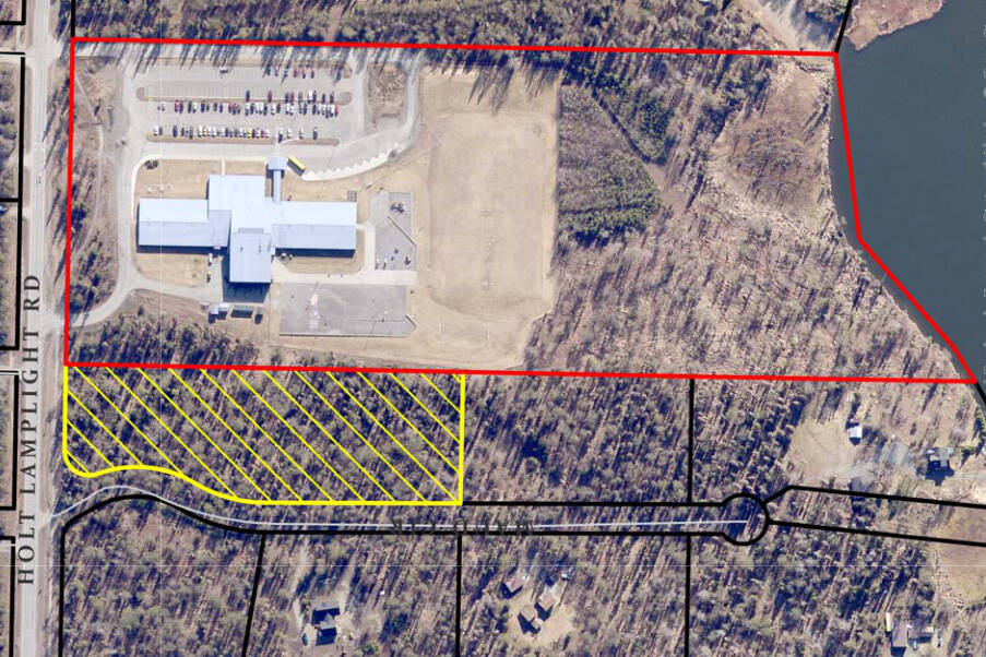 A map shows the original property boundary (in red) of Nikiski North Star Elementary and the boundary of the new property (in yellow) the borough is set to purchase. (Courtesy Kenai Peninsula Borough)