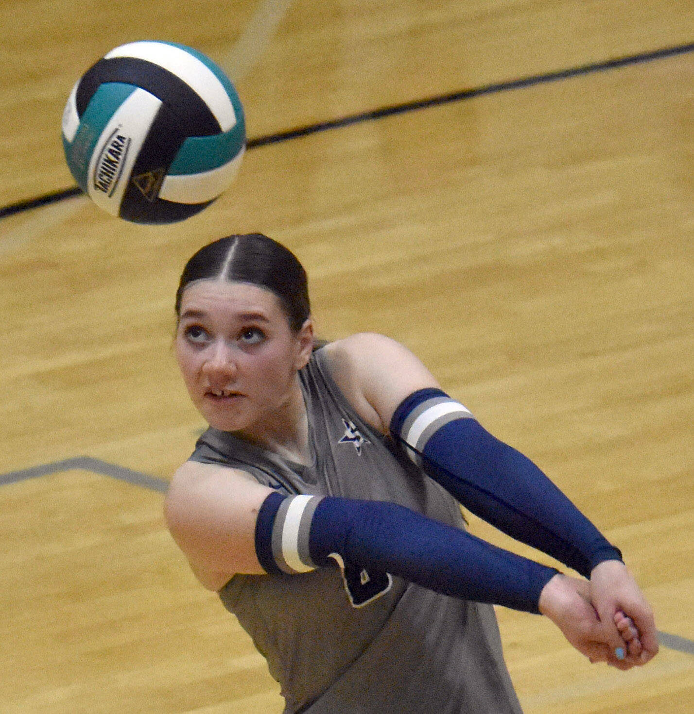 Soldotna’s Veronica Crane digs up a ball Thursday, Sept. 19, 2024, at Nikiski Middle-High School in Nikiski, Alaska. (Photo by Jeff Helminiak/Peninsula Clarion)