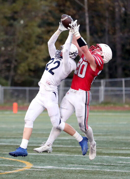 Soldotna's Matthew Schilling knocks the ball away from Wasilla's Jimmy Lackey during a 63-21 win over the Warriors Friday, Sept. 20, 2024, at Veterans Memorial Field in Wasilla, Alaska. (Bruce Eggleston/matsusports.net)