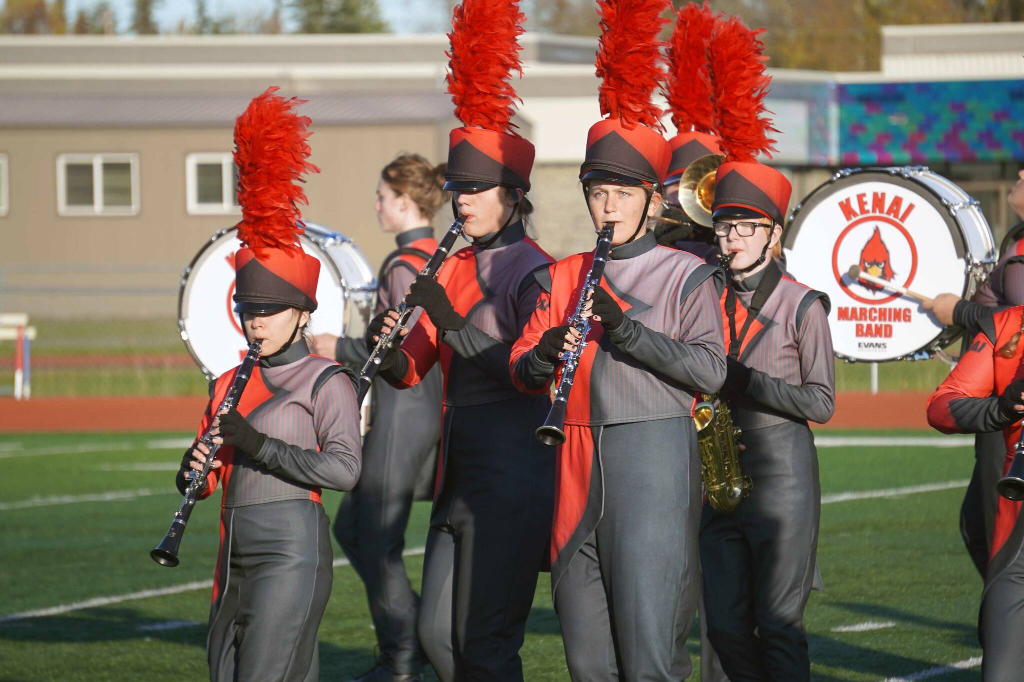 The Kenai Central High School Marching Band performs “Snakes and Songbirds: The Music of the Hunger Games” during the Kenai Marching Showcase at Ed Hollier Field in Kenai, Alaska, on Saturday, Sept. 21, 2024. (Jake Dye/Peninsula Clarion)