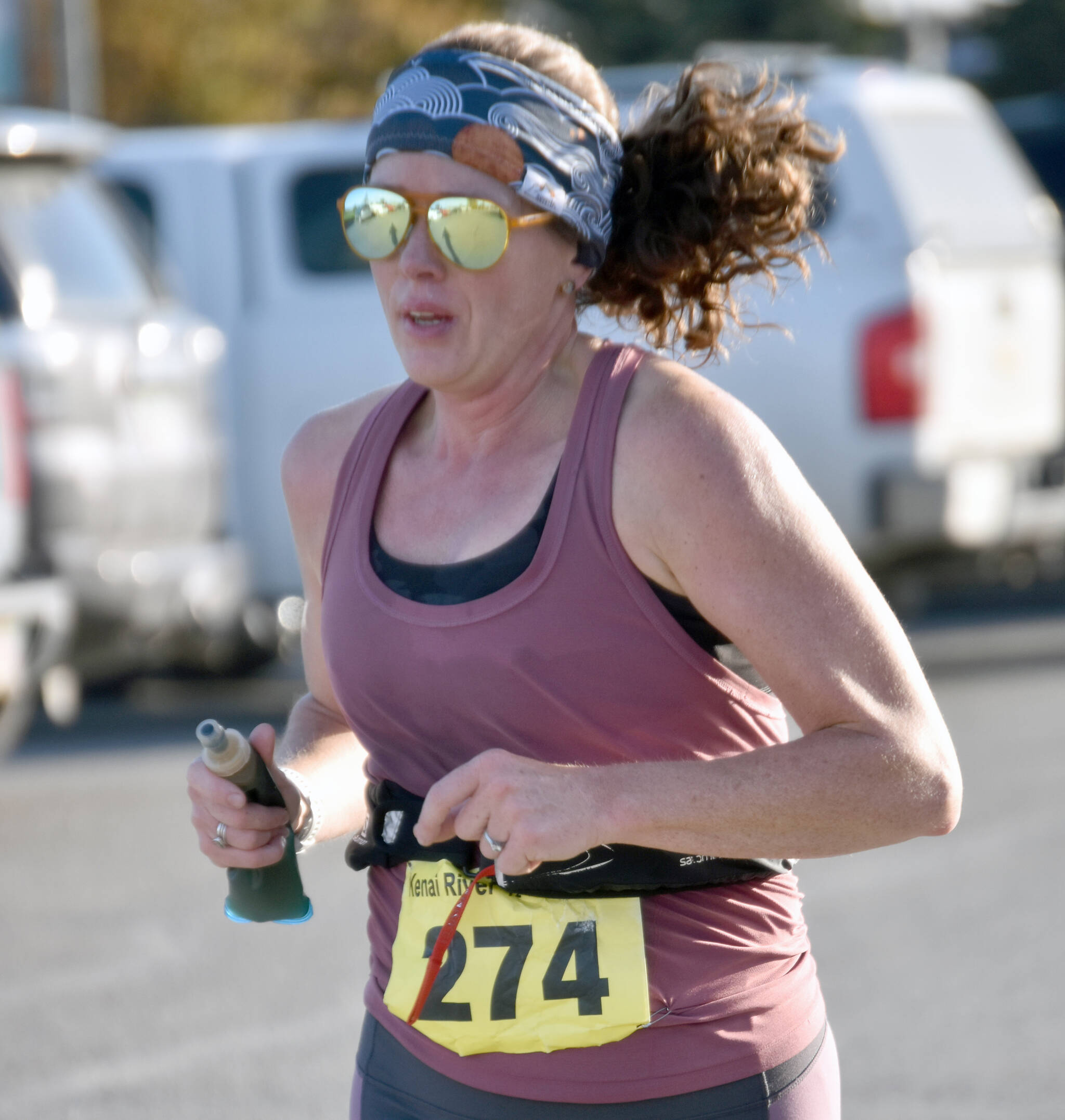 Homer’s Kristen Buckwalter runs to victory in the women’s half marathon at the Kenai River Marathon on Sunday, Sept. 29, 2024, in Kenai, Alaska. (Photo by Jeff Helminiak/Peninsula Clarion)