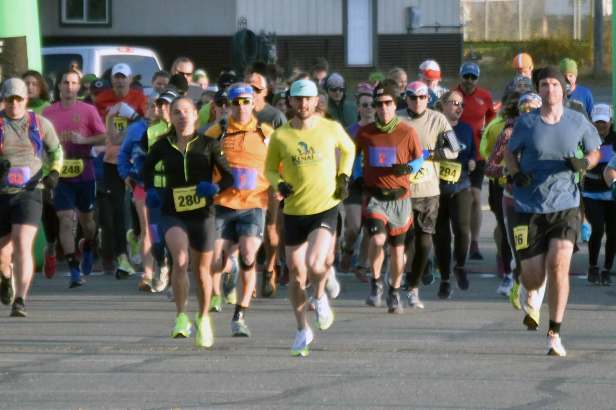 Runners start the Kenai River Marathon on Sunday, Sept. 29, 2024, in Kenai, Alaska. (Photo by Jeff Helminiak/Peninsula Clarion)