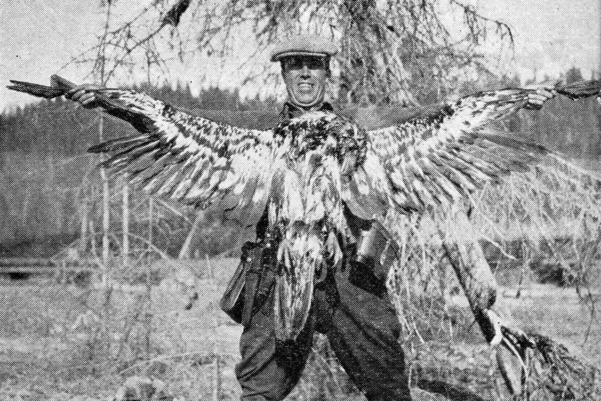 This photo of Warren Melville Nutter, holding a dead juvenile bald eagle that he shot for the bounty, appeared in the May 1938 edition of The Alaska Sportsman Magazine. The photo was probably taken near the mouth of Hidden Creek on Skilak Lake.