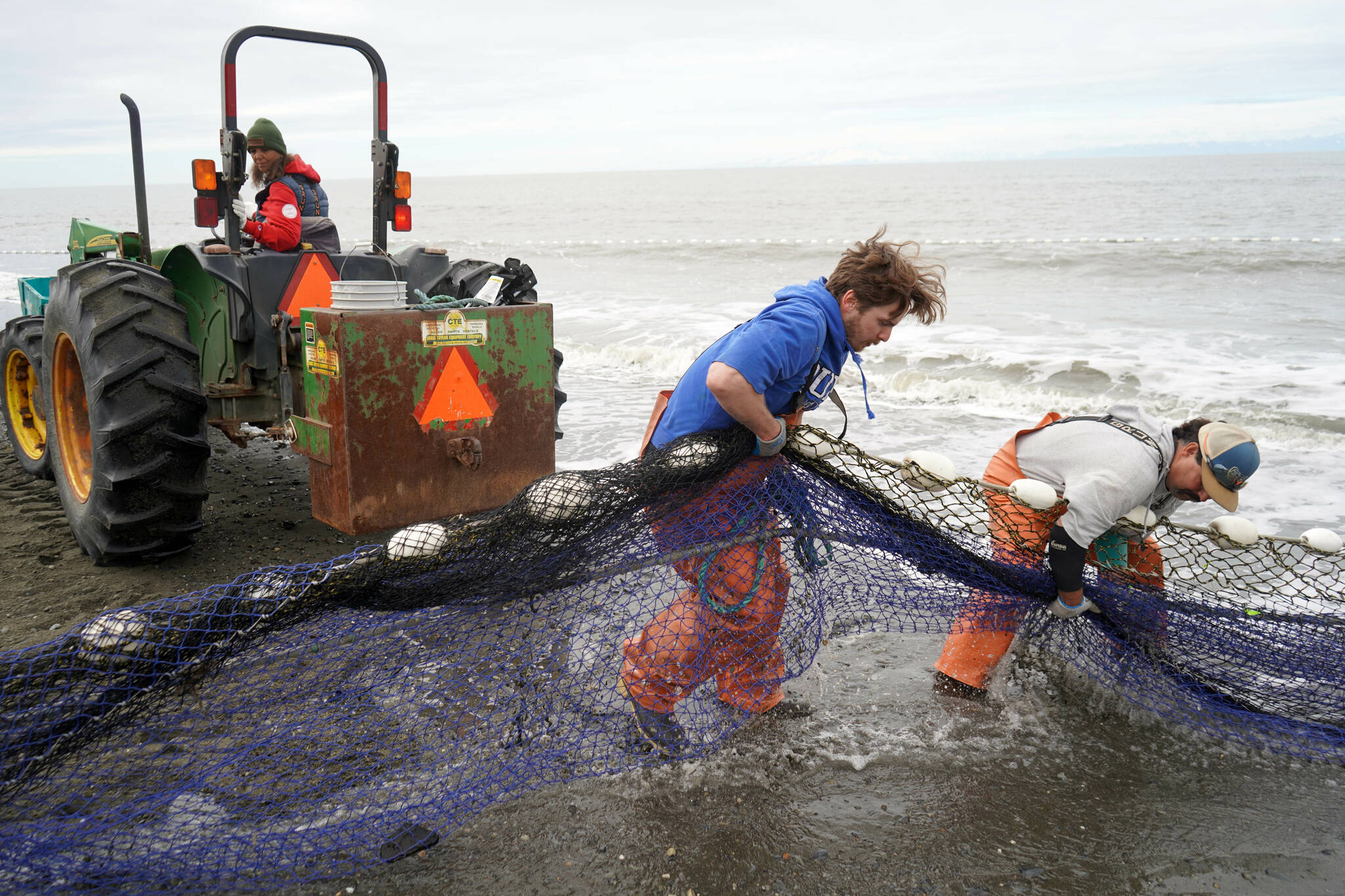 Lisa Gabriel, left, watches as beach seine nets are pulled from the waters of Cook Inlet at a test site for the gear near Kenai, Alaska, on Tuesday, July 30, 2024. (Jake Dye/Peninsula Clarion)