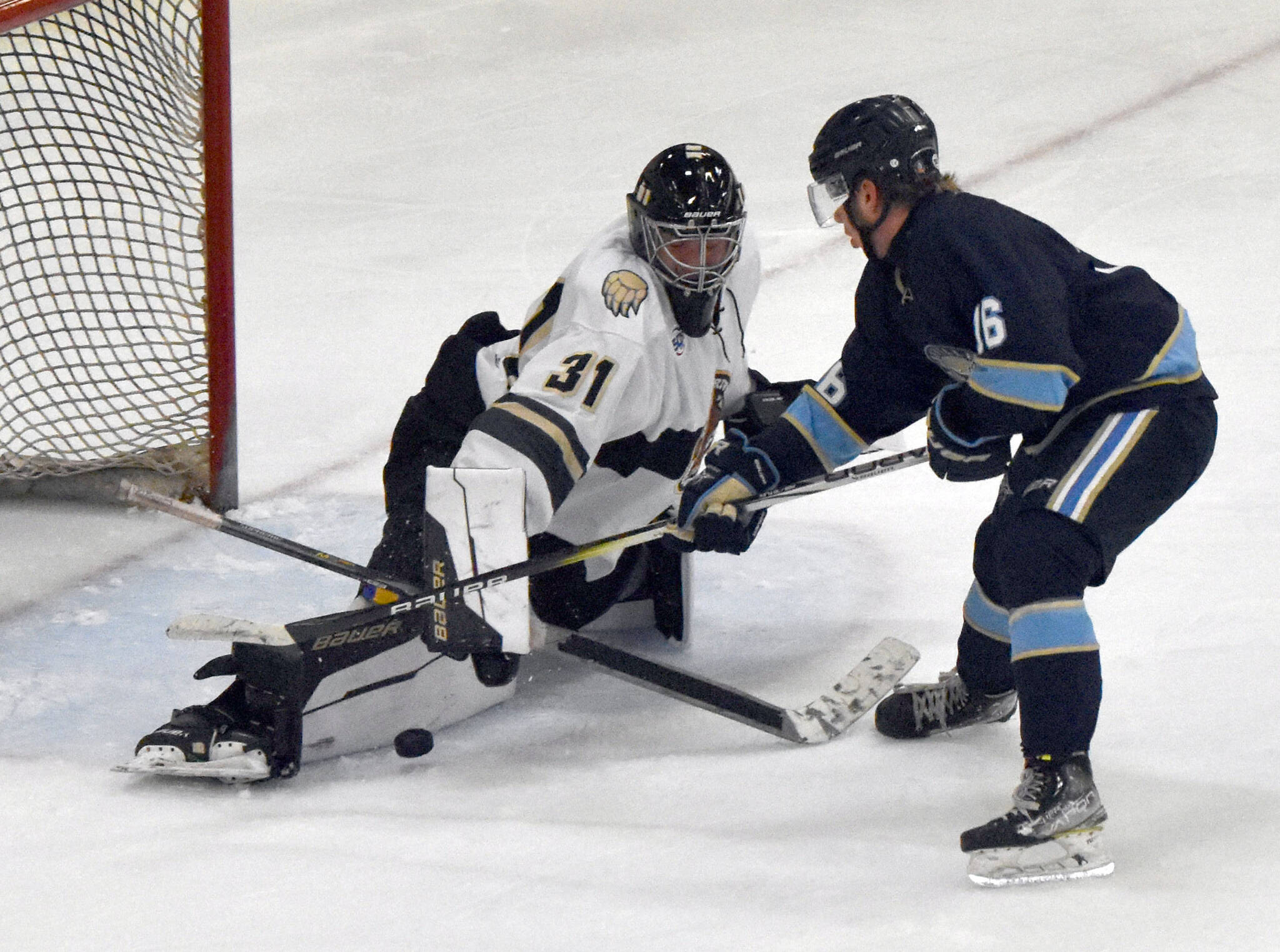 Kenai River Brown Bears goalie Leif Ekblad stops a breakaway by Hans Hedlund of the Janesville (Wisconsin) Jets on Sunday, Oct. 6, 2024, at the Soldotna Regional Sports Complex in Soldotna, Alaska. (Photo by Jeff Helminiak/Peninsula Clarion)