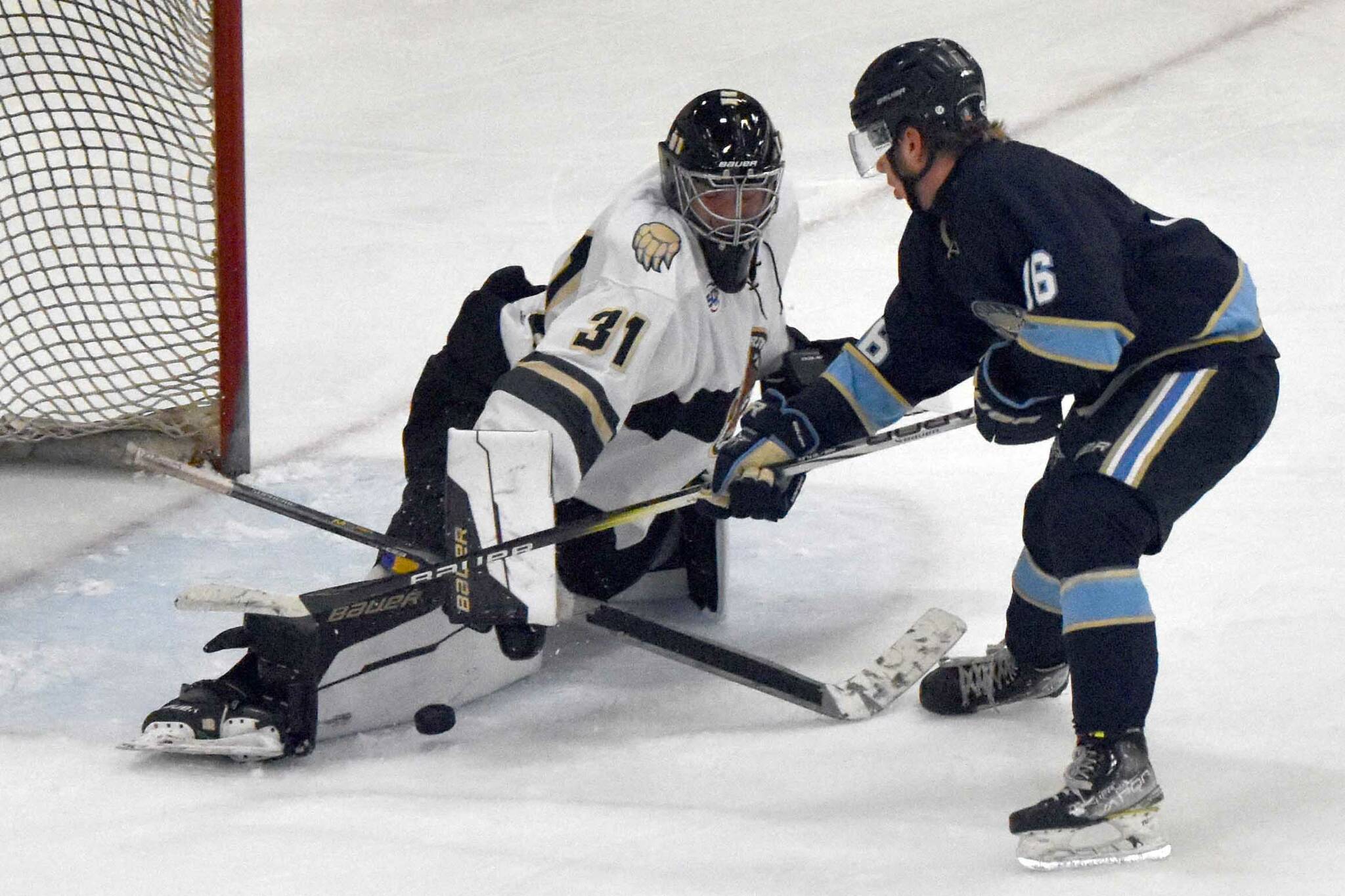 Kenai River Brown Bears goalie Leif Ekblad stops a breakaway by Hans Hedlund of the Janesville (Wisconsin) Jets on Sunday, Oct. 6, 2024, at the Soldotna Regional Sports Complex in Soldotna, Alaska. (Photo by Jeff Helminiak/Peninsula Clarion)