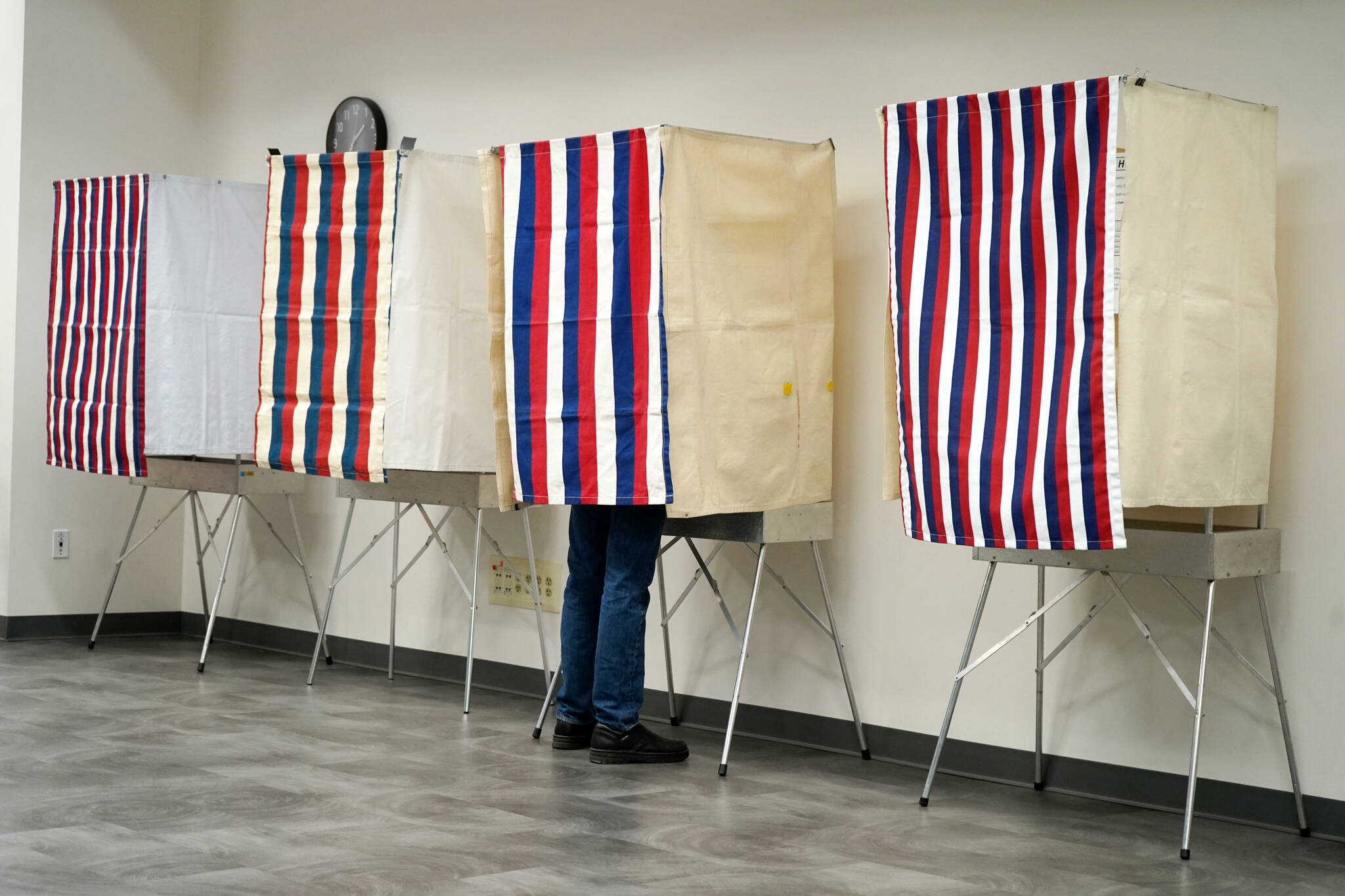 A voter fills out their ballot at the Kenai No. 2 Precinct in the Challenger Learning Center of Alaska in Kenai, Alaska, on Tuesday, Oct. 1, 2024. (Jake Dye/Peninsula Clarion)