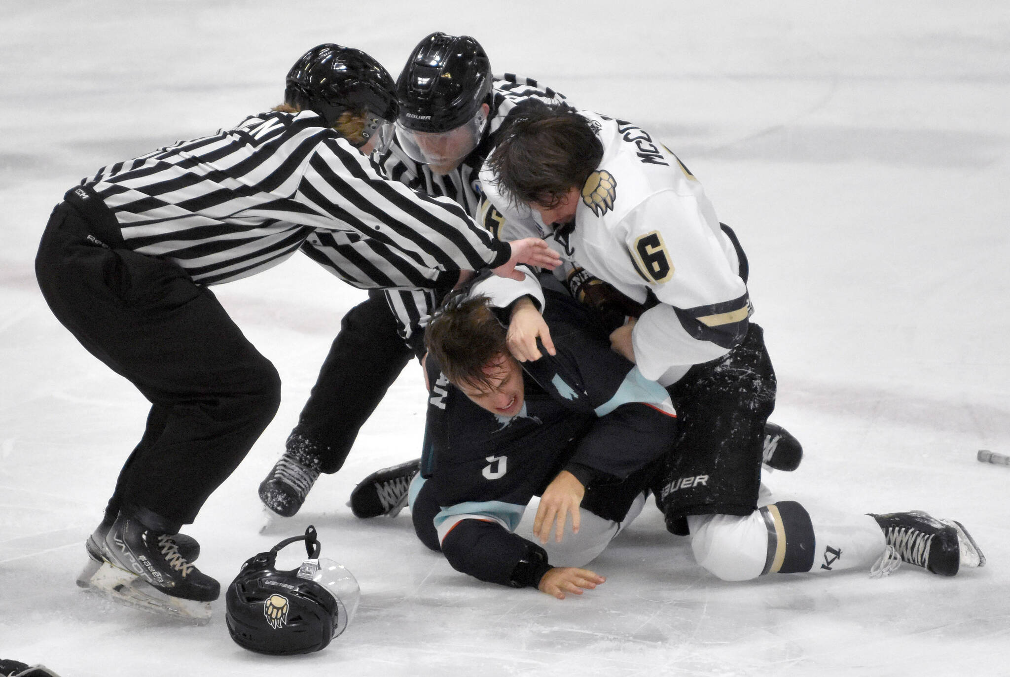 Cole Christian of the Anchorage Wolverines and Carter McCormick of the Kenai River Brown Bears fight Saturday, Oct. 12, 2024, at the Soldotna Regional Sports Complex in Soldotna, Alaska. (Photo by Jeff Helminiak/Peninsula Clarion)