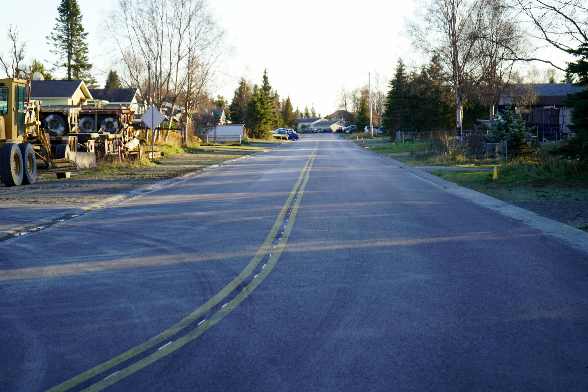 Fresh pavement stretches along Lilac Lane in Kenai, Alaska, on Friday, Oct. 18, 2024. (Jake Dye/Peninsula Clarion)