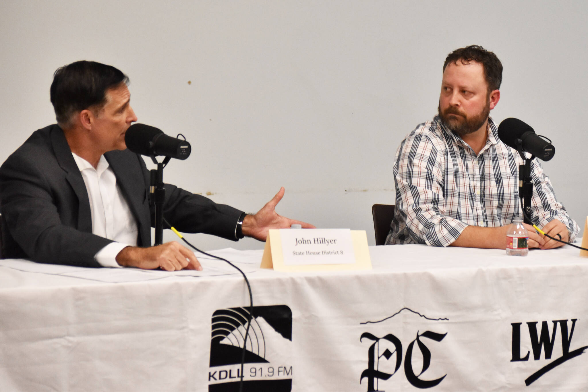 Alaska House of Representatives District 8 candidates John Hillyer and Bill Elam shake answer questions during the Peninsula Clarion and KDLL 91.9 FM candidate forum at the Soldotna Public Library on Monday, Oct. 21, 2024, in Soldotna, Alaska. (Photo by Erin Thompson/Peninsula Clarion)