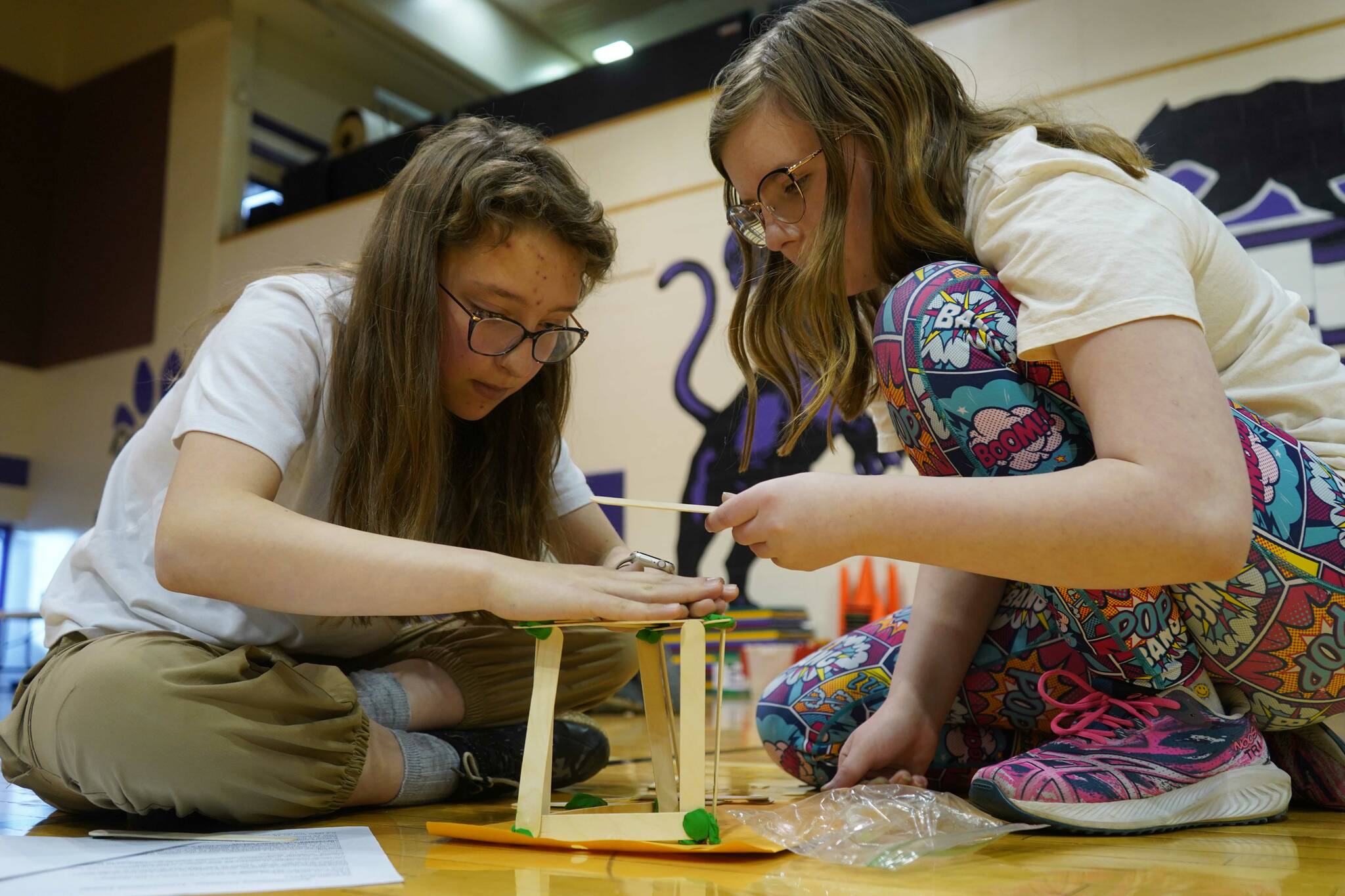 Teams assemble towers during the Spontaneous Challenge portion of the Mind-A-Mazes competition at Skyview Middle School near Soldotna, Alaska, on Saturday, Oct. 19, 2024. (Jake Dye/Peninsula Clarion)