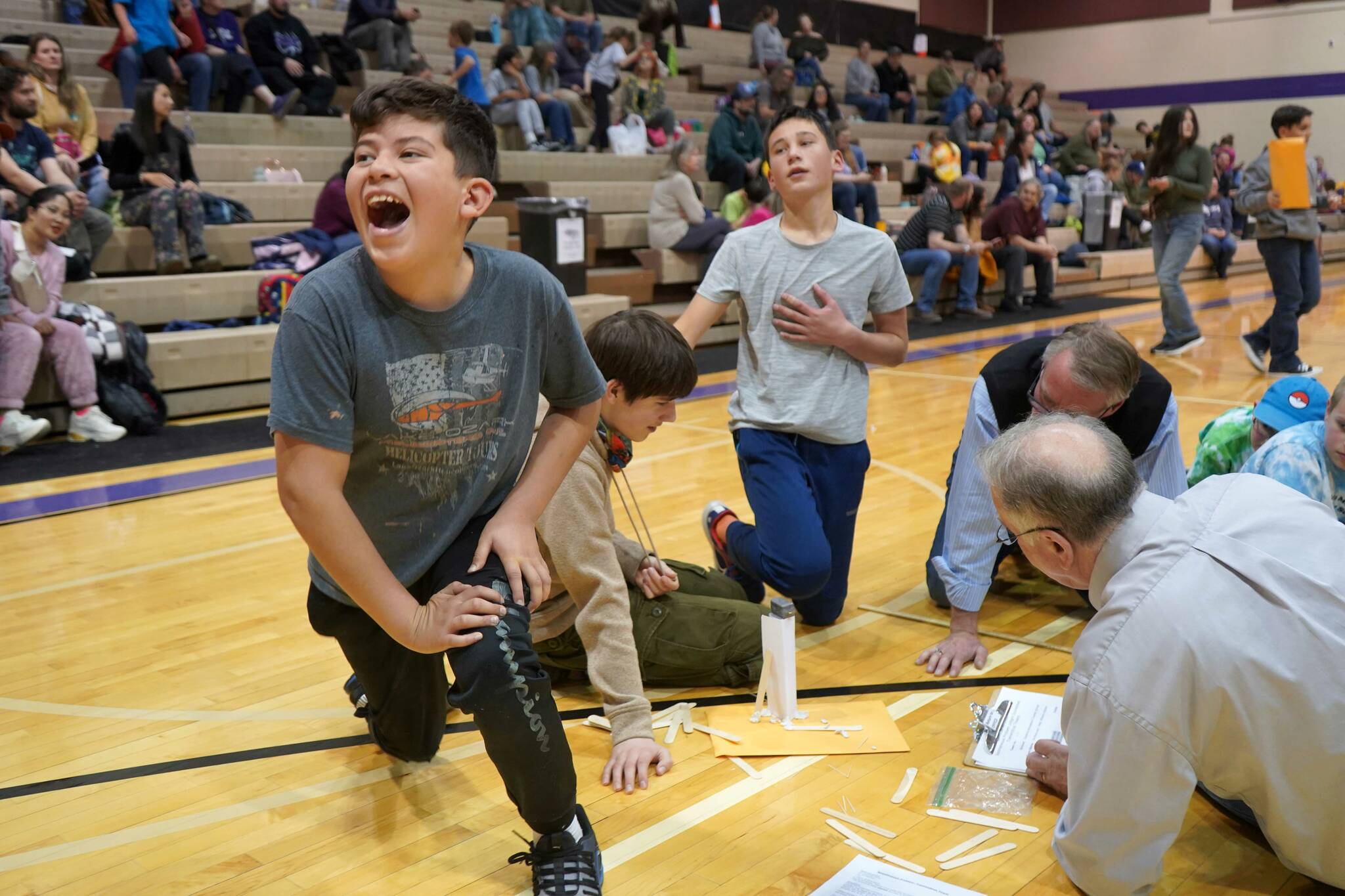 Team Bluey celebrate their tower’s success during the Spontaneous Challenge portion of the Mind-A-Mazes competition at Skyview Middle School near Soldotna, Alaska, on Saturday, Oct. 19, 2024. (Jake Dye/Peninsula Clarion)