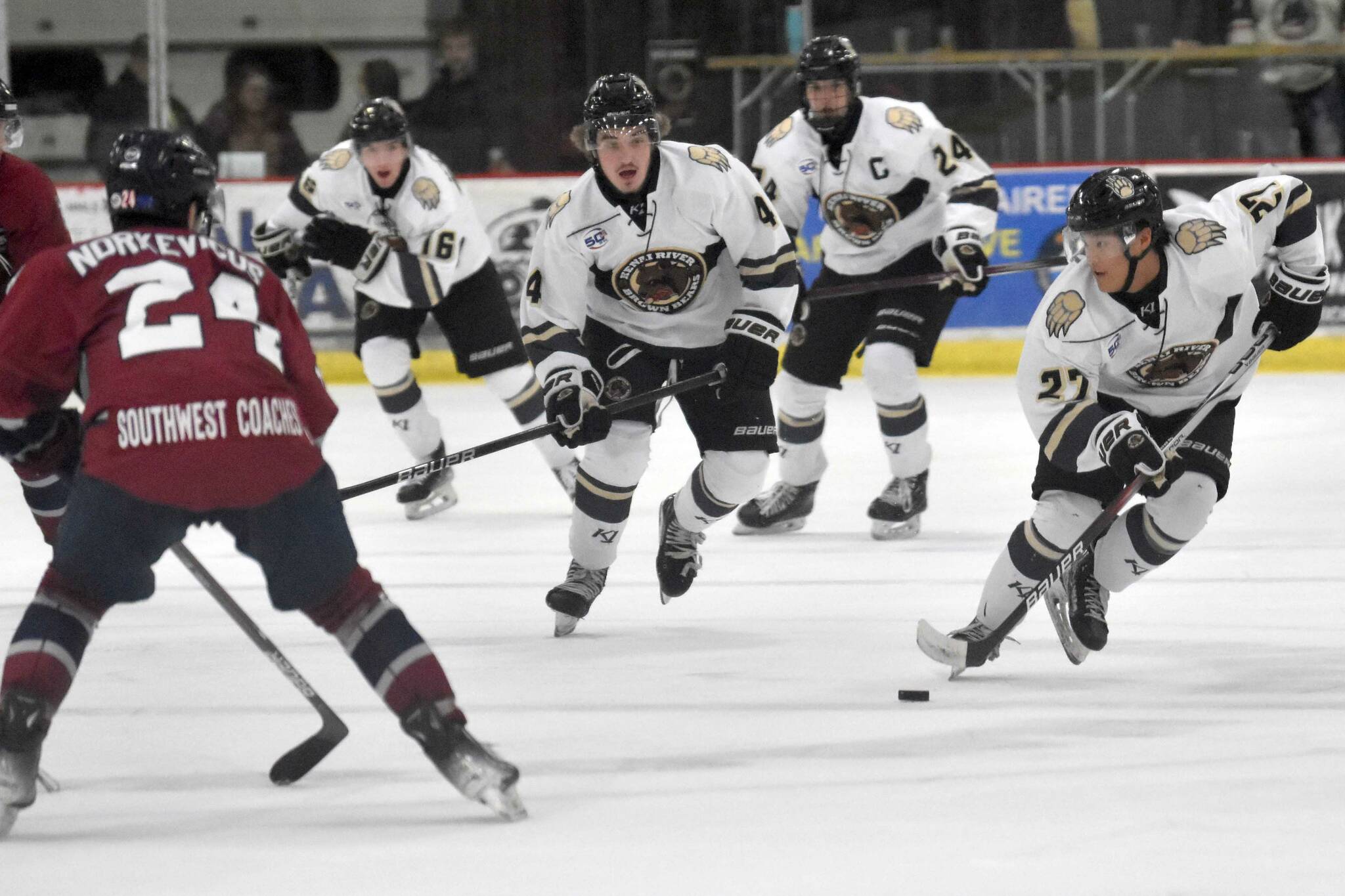 Joseph Yoon of the Kenai River Brown Bears brings the puck up the ice Friday, Oct. 25, 2024, at the Soldotna Regional Sports Complex in Soldotna, Alaska. (Photo by Jeff Helminiak/Peninsula Clarion)