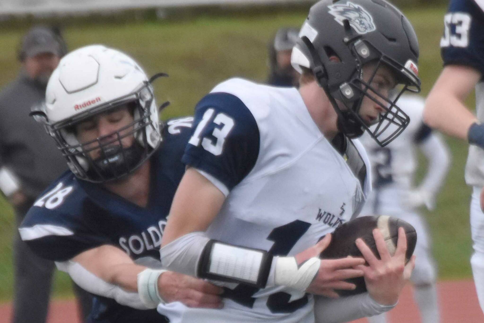 Eagle River quarterback Nolan Beaty is sacked by Soldotna linebacker Wyatt Faircloth on Friday, Sept. 27, 2024, at Justin Maile Field at Soldotna High School in Soldotna, Alaska. (Photo by Jeff Helminiak/Peninsula Clarion)