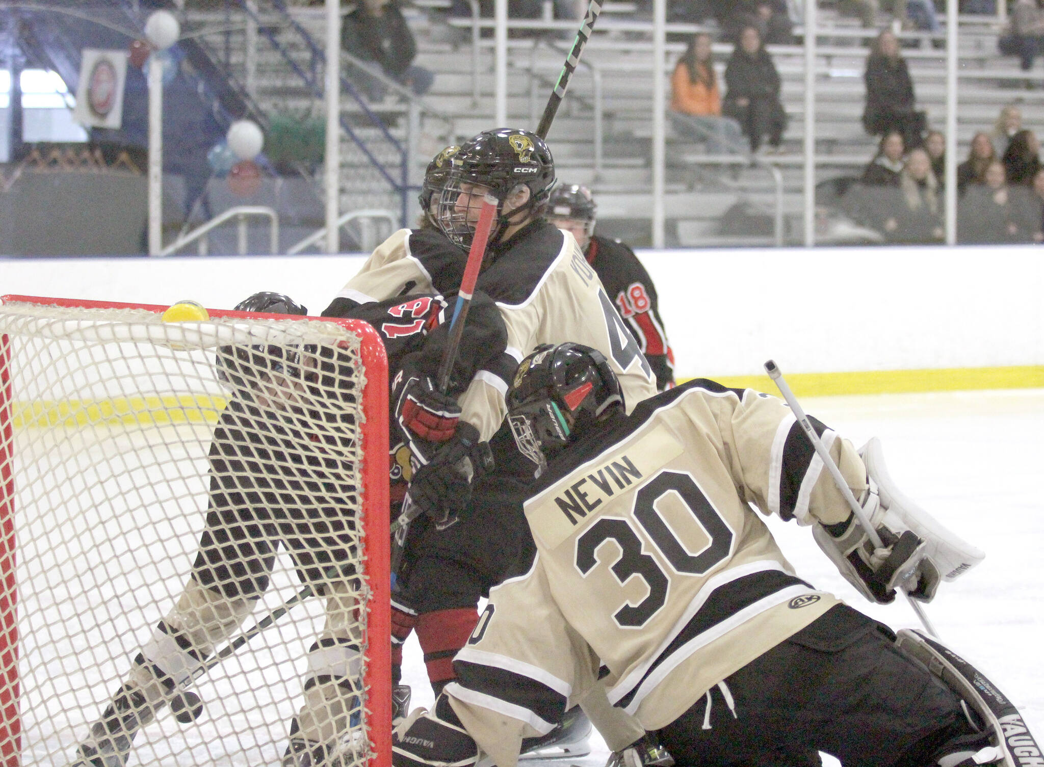 Kenai Central forward William Howard tries to force the puck into the net during a 4-3 win over South Anxchorage in the Alaska Armed Forces Stars and Stripes Showdown on Friday, Nov. 8, 2024, at the MTA Events Center in Palmer. (Photo by Jeremiah Bartz/Frontiersman)