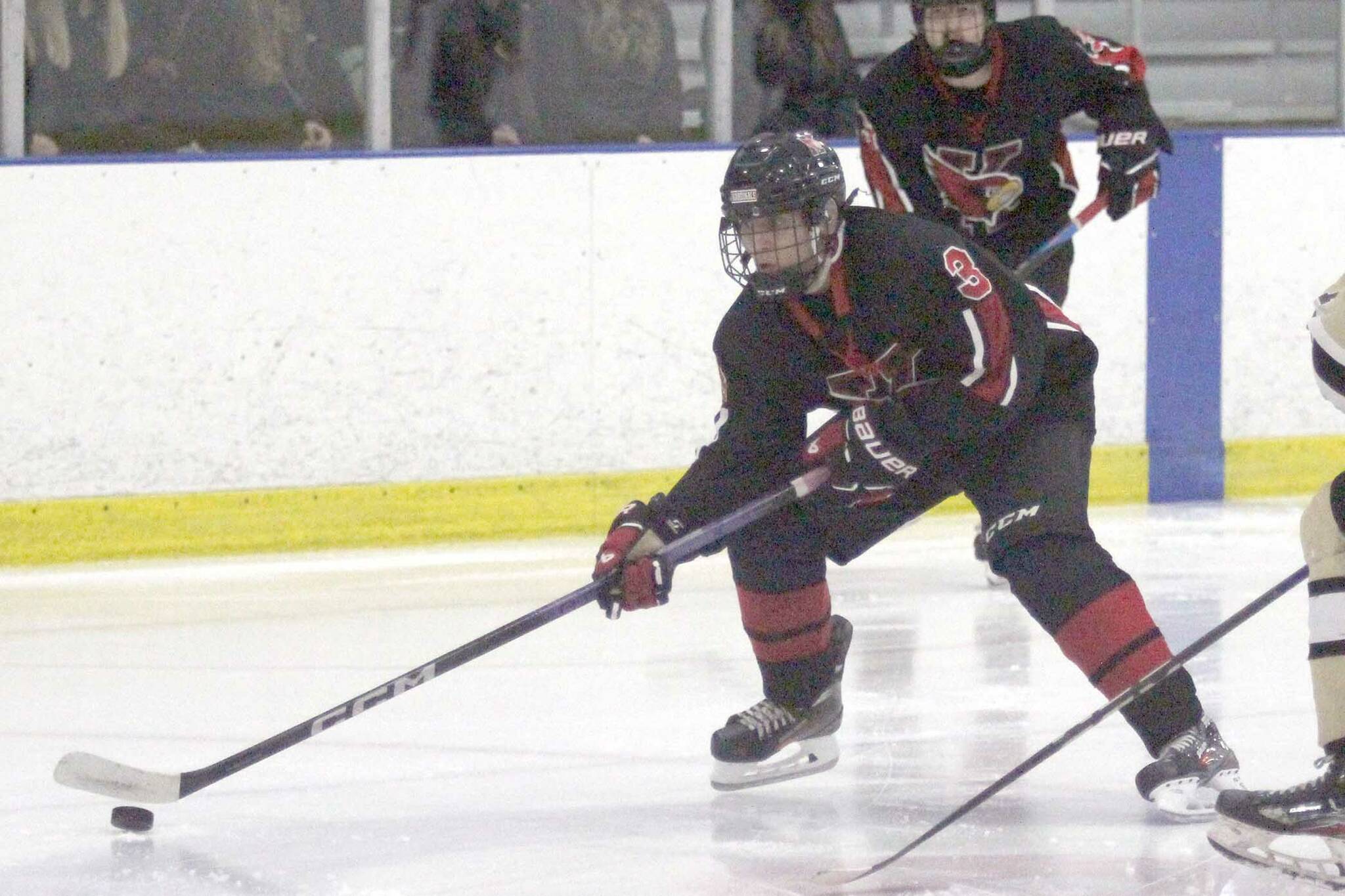 Kenai forward Logan Mese skates by the defenseman during a 4-3 win over South Anchorage in the Alaska Armed Forces Stars and Stripes Showdown on Friday, Nov. 8, 2024, at the MTA Events Center in Palmer. (Photo by Jeremiah Bartz/Frontiersman)