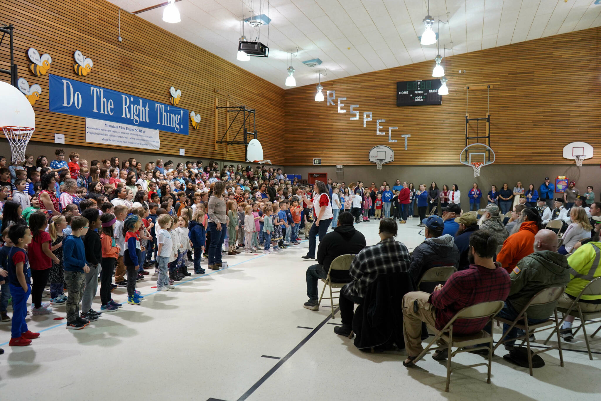 Students sing “My Country, ‘Tis of Thee” at Mountain View Elementary in Kenai, Alaska, during a celebration of Veterans Day on Monday, Nov. 11, 2024. (Jake Dye/Peninsula Clarion)