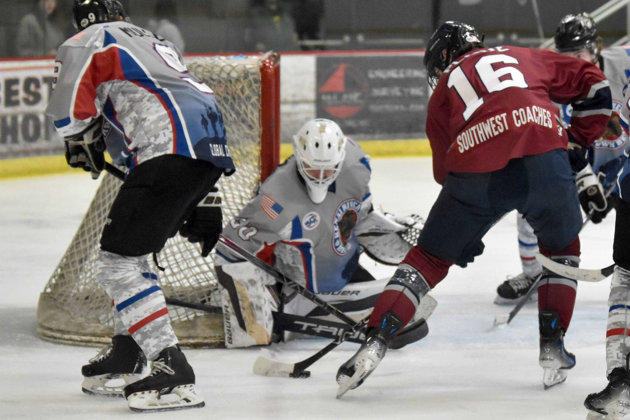 Kenai River Brown Bears goalie Owen Zenone makes a save on Luc Plante of the Fairbanks Ice Dogs on Friday, Nov. 15, 2024, at the Soldotna Regional Sports Complex in Soldotna, Alaska. (Photo by Jeff Helminiak/Peninsula Clarion)