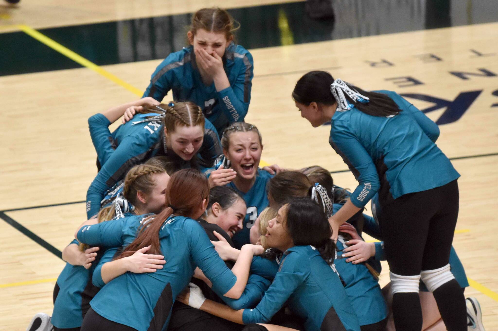 Nikiski celebrates winning the championship Saturday, Nov. 16, 2024, in the Class 3A state volleyball final at the Alaska Airlines Center in Anchorage, Alaska. (Photo by Jeff Helminiak/Peninsula Clarion)