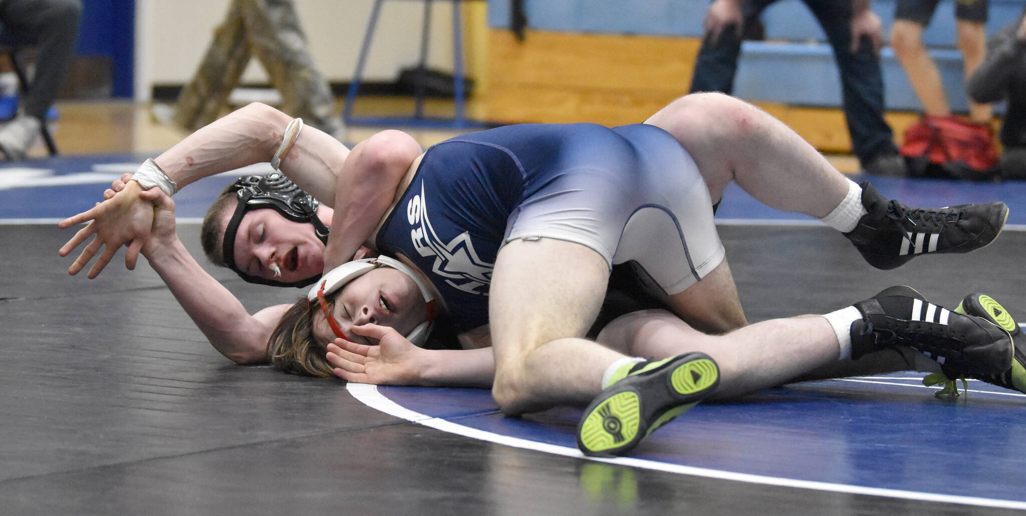 Soldotna’s Jackson Anding wrestles to a major decision over Ninilchik’s Brandt Mill on Tuesday, Nov. 19, 2024, at Soldotna High School in Soldotna, Alaska. (Photo by Jeff Helminiak/Peninsula Clarion)