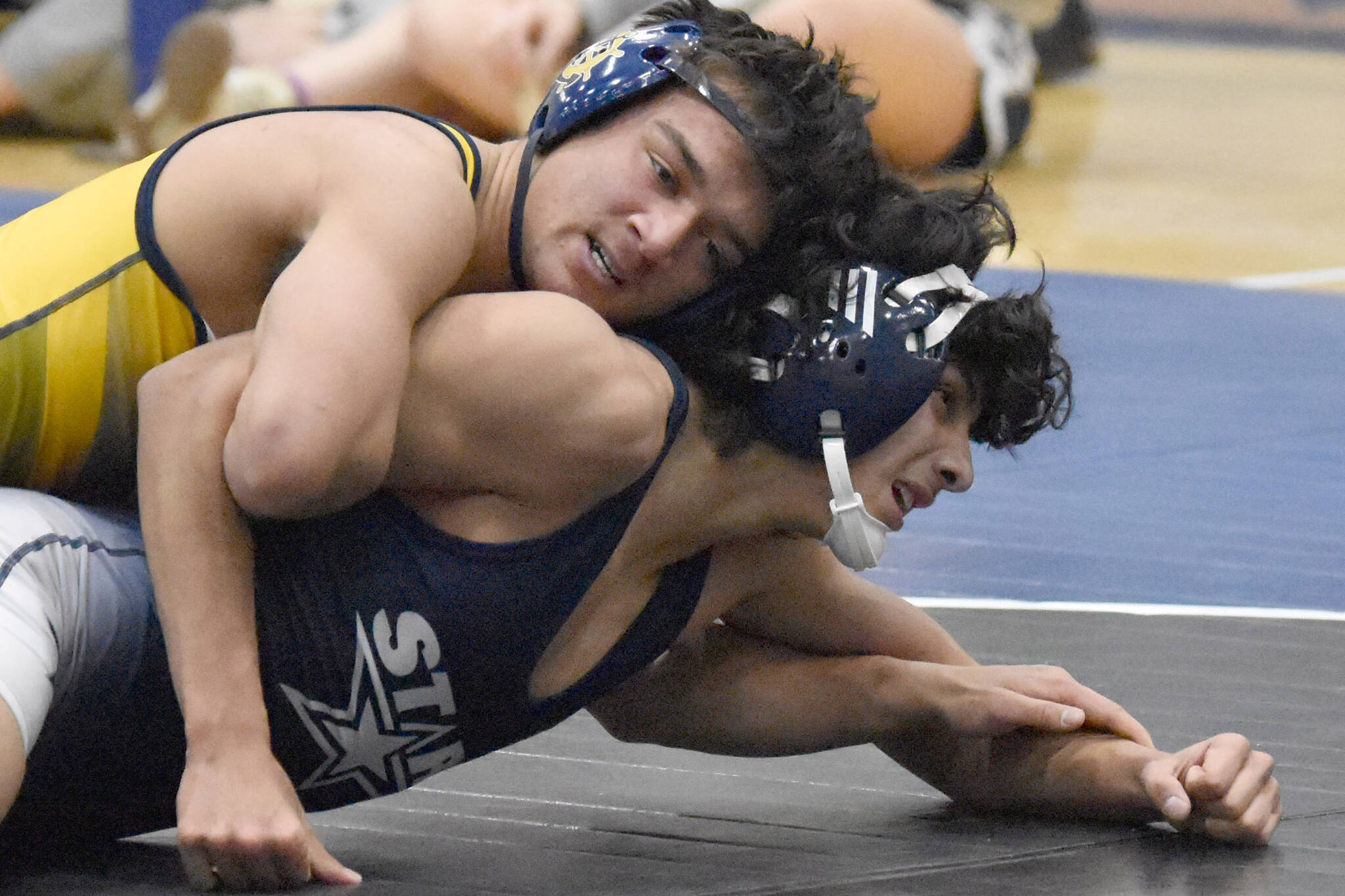 Homer's Paul Minke wrestles to a pin of Soldotna's Harold Rudstrom on Tuesday, Nov. 19, 2024, at Soldotna High School in Soldotna, Alaska. (Photo by Jeff Helminiak/Peninsula Clarion)