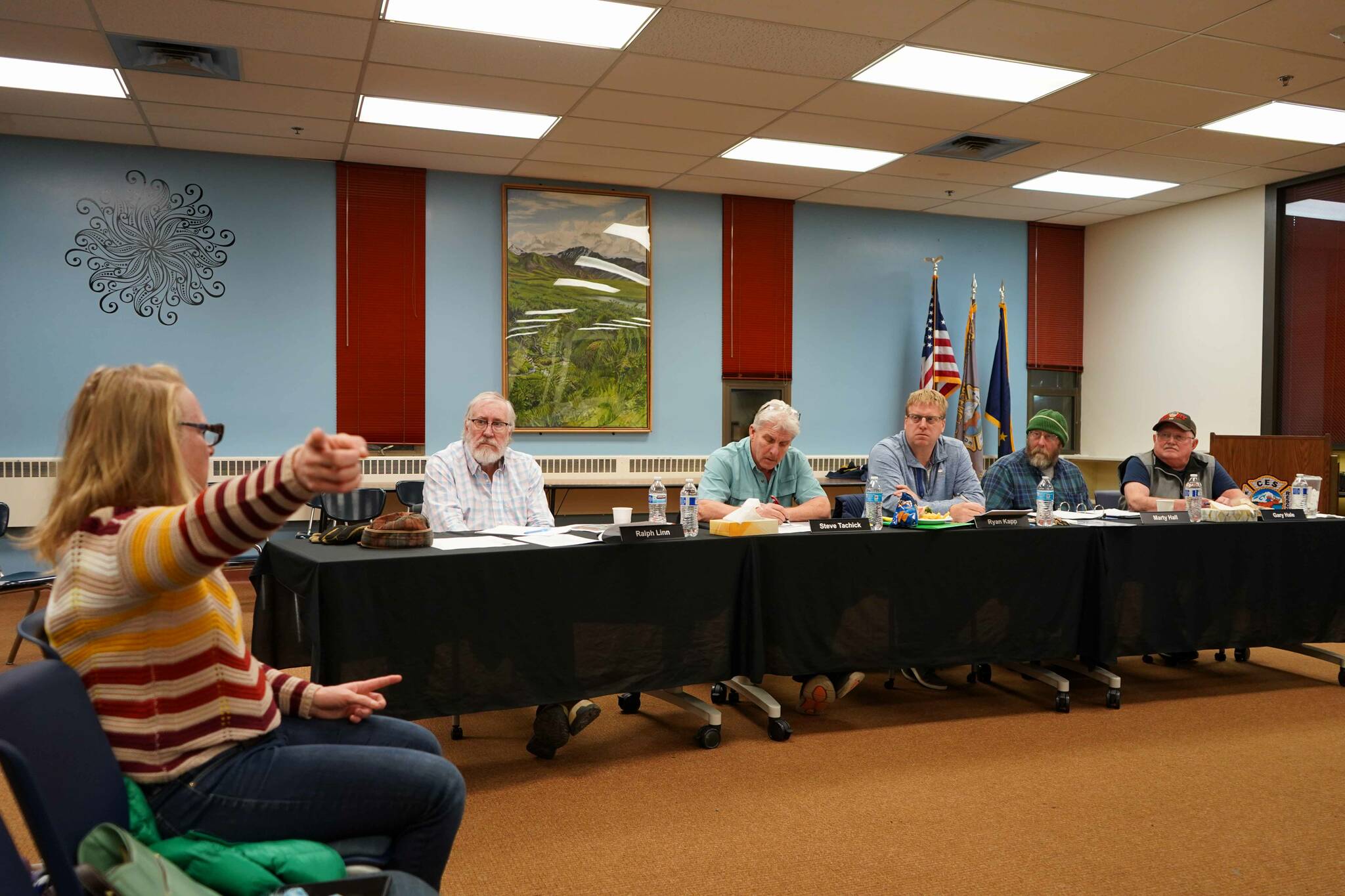 Jill Garnet, left, calls for full-time staffing of the Central Emergency Services’ Kasilof station during a meeting of the CES Joint Operational Service Area Board on Thursday, Nov. 21, 2024, at Soldotna Prep School in Soldotna, Alaska. (Jake Dye/Peninsula Clarion)