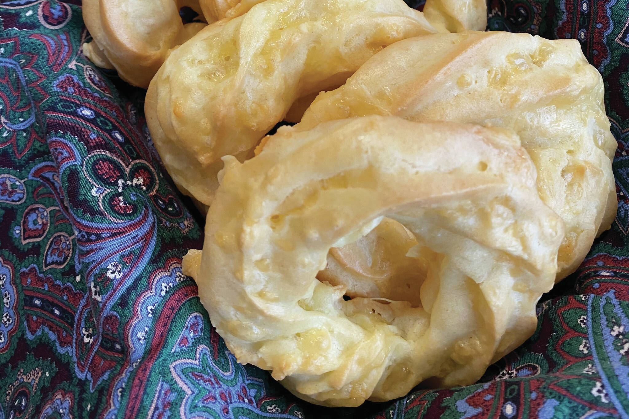 These light and savory cheesy ring puff snacks are piped pate a choux with a generous handful of shredded Edam cheese. (Photo by Tressa Dale/Peninsula Clarion)