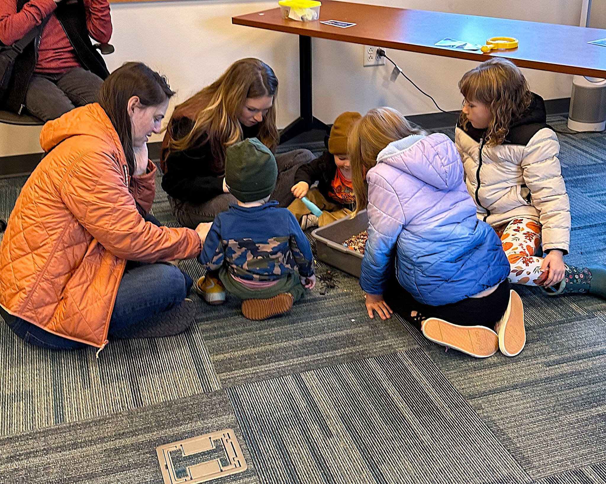 Families enjoyed exploring the sensory spider bin. (Photo courtesy Kenai National Wildlife Refuge)