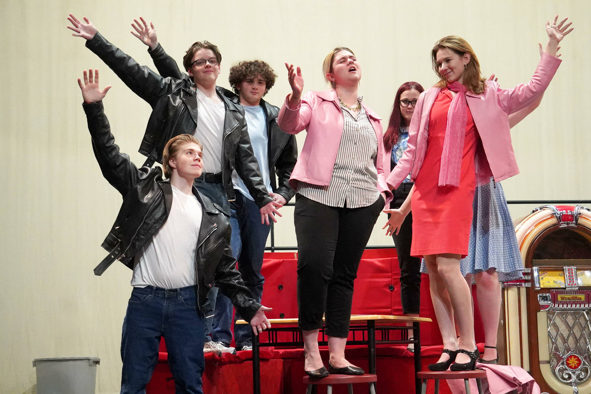 The cast of Soldotna High School’s “Grease” rehearse in the Soldotna High School auditorium in Soldotna, Alaska, on Monday, Nov. 25, 2024. (Jake Dye/Peninsula Clarion)