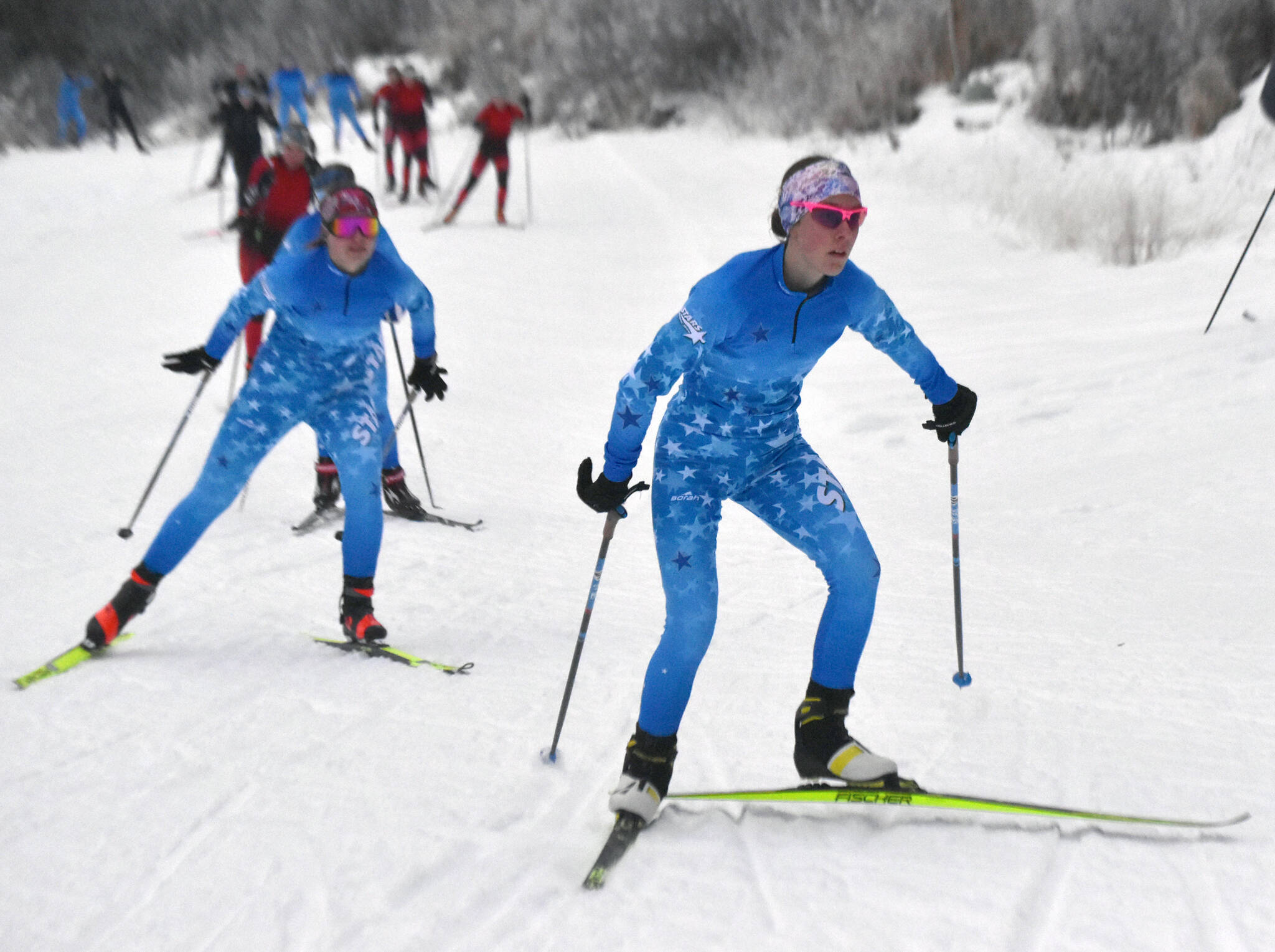 Soldotna’s Tania Boonstra leads Soldotna’s Ariana Cannava and the rest of the pack at the girls varsity race of the Turkey Skate on Tuesday, Nov. 26, 2024, at Tsalteshi Trails just outside of Soldotna, Alaska. (Photo by Jeff Helminiak/Peninsula Clarion)