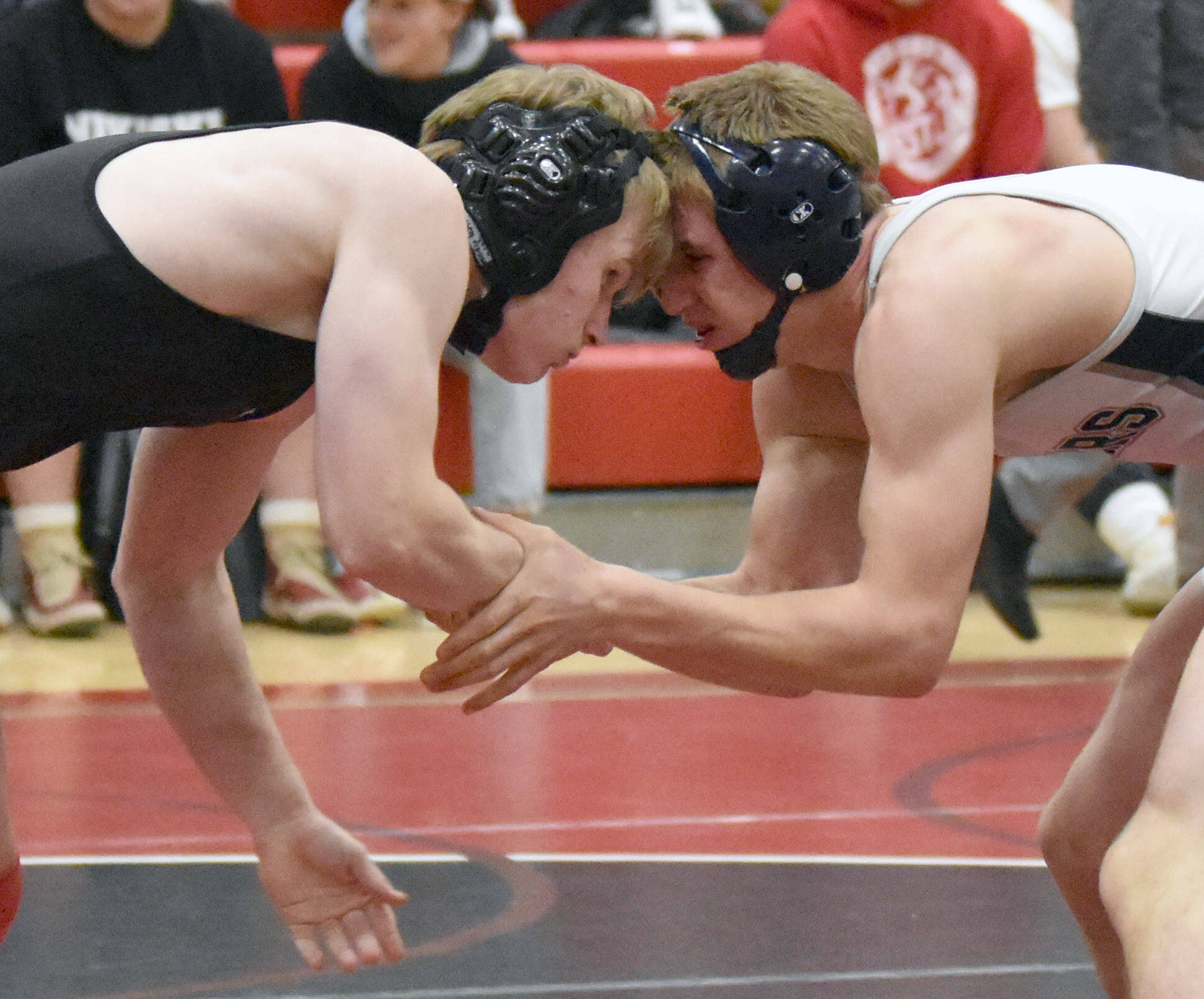 Kenai Central’s Daniel Steffensen and Soldotna’s Michael Dickinson wrestle Tuesday, Dec. 3, 2024, at Kenai Central High School in Kenai, Alaska. (Photo by Jeff Helminiak/Peninsula Clarion)