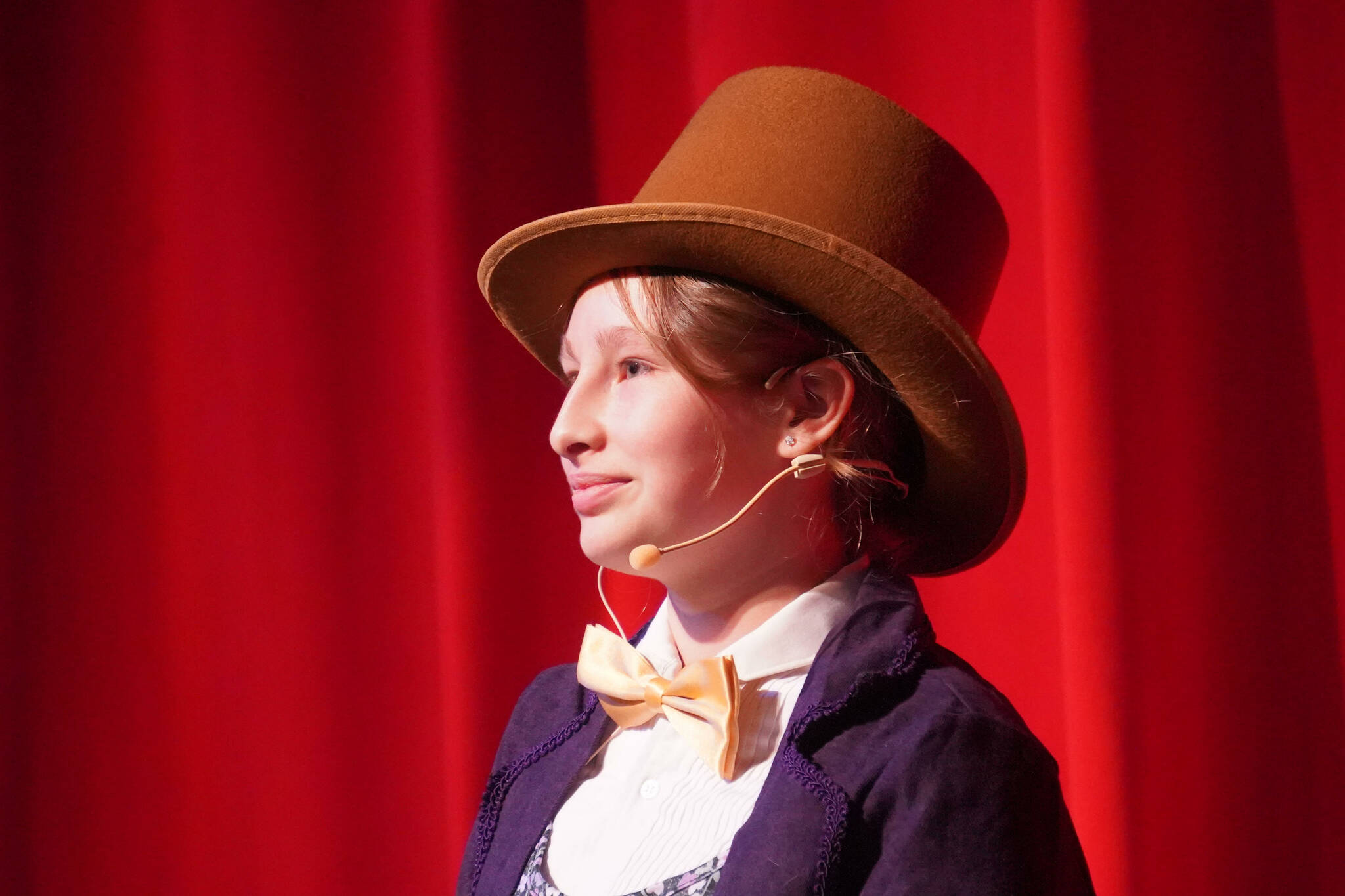 McKinley Frary portrays Willy Wonka in a rehearsal of Nikiski Bulldog Theatre’s “Willy Wonka Jr.” at Nikiski Middle/High School on Tuesday, Dec. 3, 2024. (Jake Dye/Peninsula Clarion)