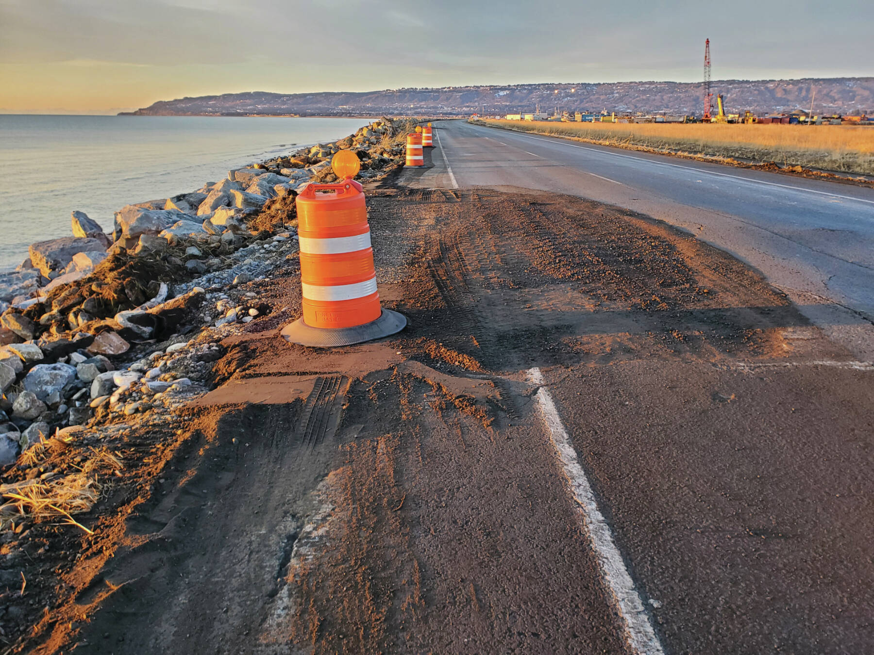 Sections of Homer Spit Road that were damaged in the Nov. 16 storm surge are temporarily repaired with gravel, as seen on Thursday, Nov. 21, 2024, in Homer, Alaska. (Delcenia Cosman/Homer News)