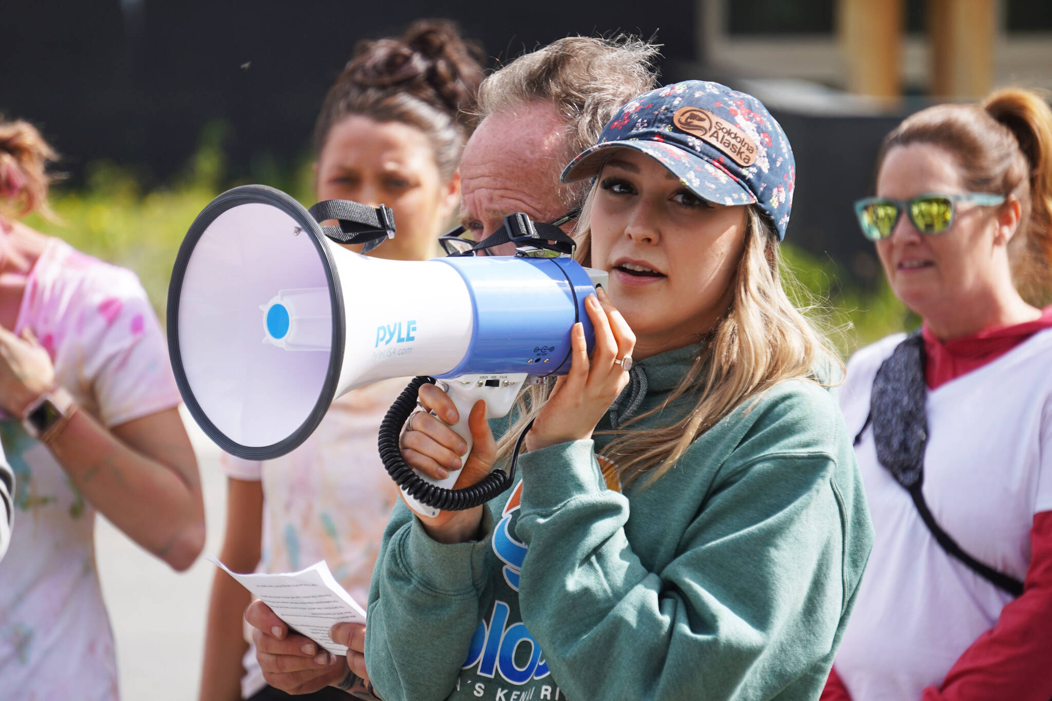 Soldotna Chamber of Commerce Executive Director Maddy Olsen speaks during a color run held as part of during the Levitt AMP Soldotna Music Series on Wednesday, June 7, 2023, at the Kenai National Wildlife Refuge Visitor’s Center in Soldotna, Alaska. (Jake Dye/Peninsula Clarion)