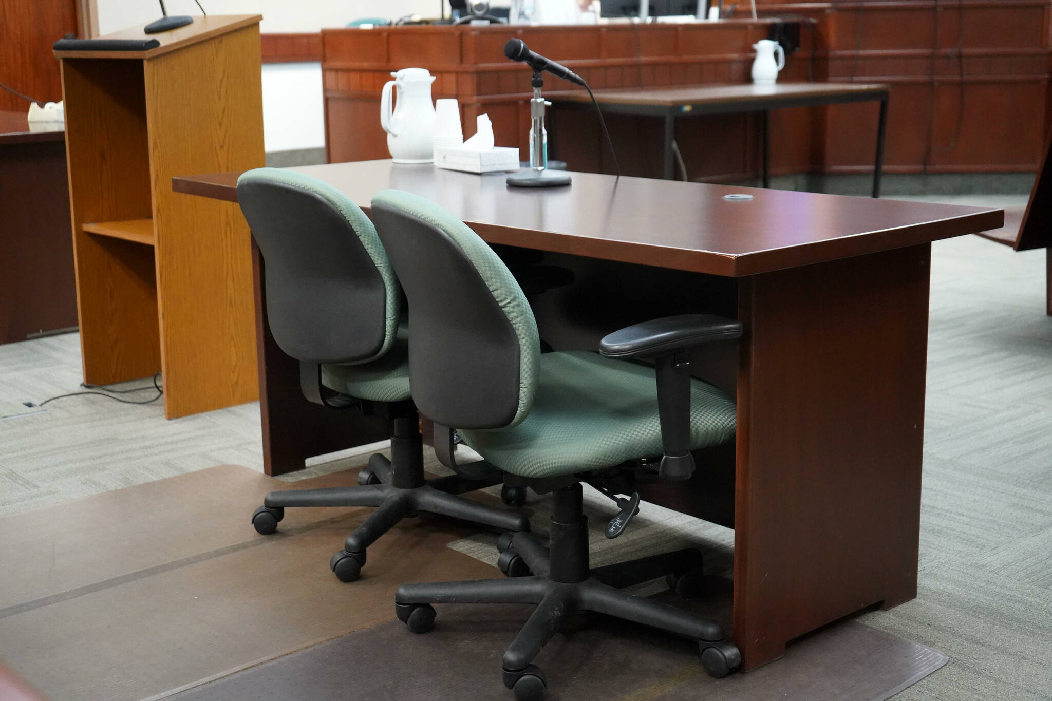 A table used by parties to a case sits empty in Courtroom 4 of the Kenai Courthouse in Kenai, Alaska, on Wednesday, Dec. 11, 2024. (Jake Dye/Peninsula Clarion)