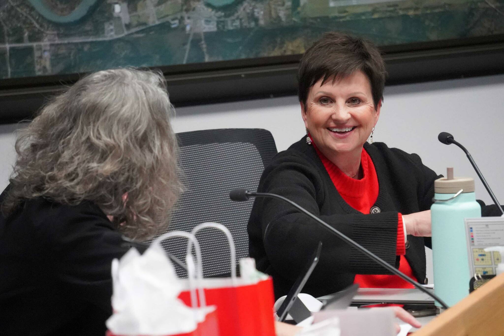 Soldotna City Manager Janette Bower, right, speaks to Soldotna Vice Mayor Lisa Parker during a meeting of the Soldotna City Council in Soldotna, Alaska, on Wednesday, Dec. 18, 2024. (Jake Dye/Peninsula Clarion)