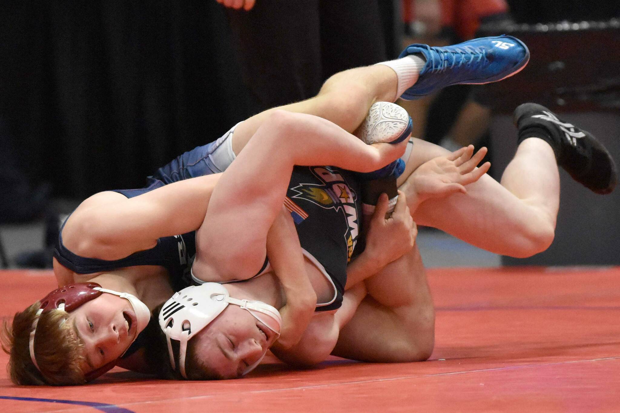 Soldotna's Jacob Strausbaugh wrestles to a technical fall against Student Wrestling Development Program's Brian Grabner in the final at 135 pounds at the Division I state wrestling tournament Saturday, Dec. 21, 2024, at the Alaska Airlines Center in Anchorage, Alaska. (Photo by Jeff Helminiak/Peninsula Clarion)