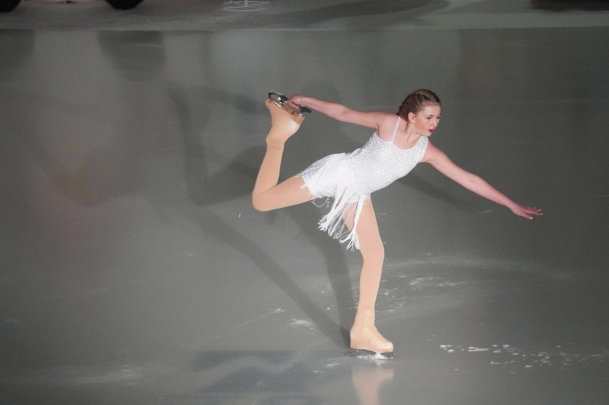 Paetyn Wimberly performs “The Christmas That I Know” during the 23rd Annual Christmas Lights and Holiday Nights Skating Recital at the Soldotna Regional Sports Complex in Soldotna, Alaska, on Saturday, Dec. 21, 2024. (Jake Dye/Peninsula Clarion)