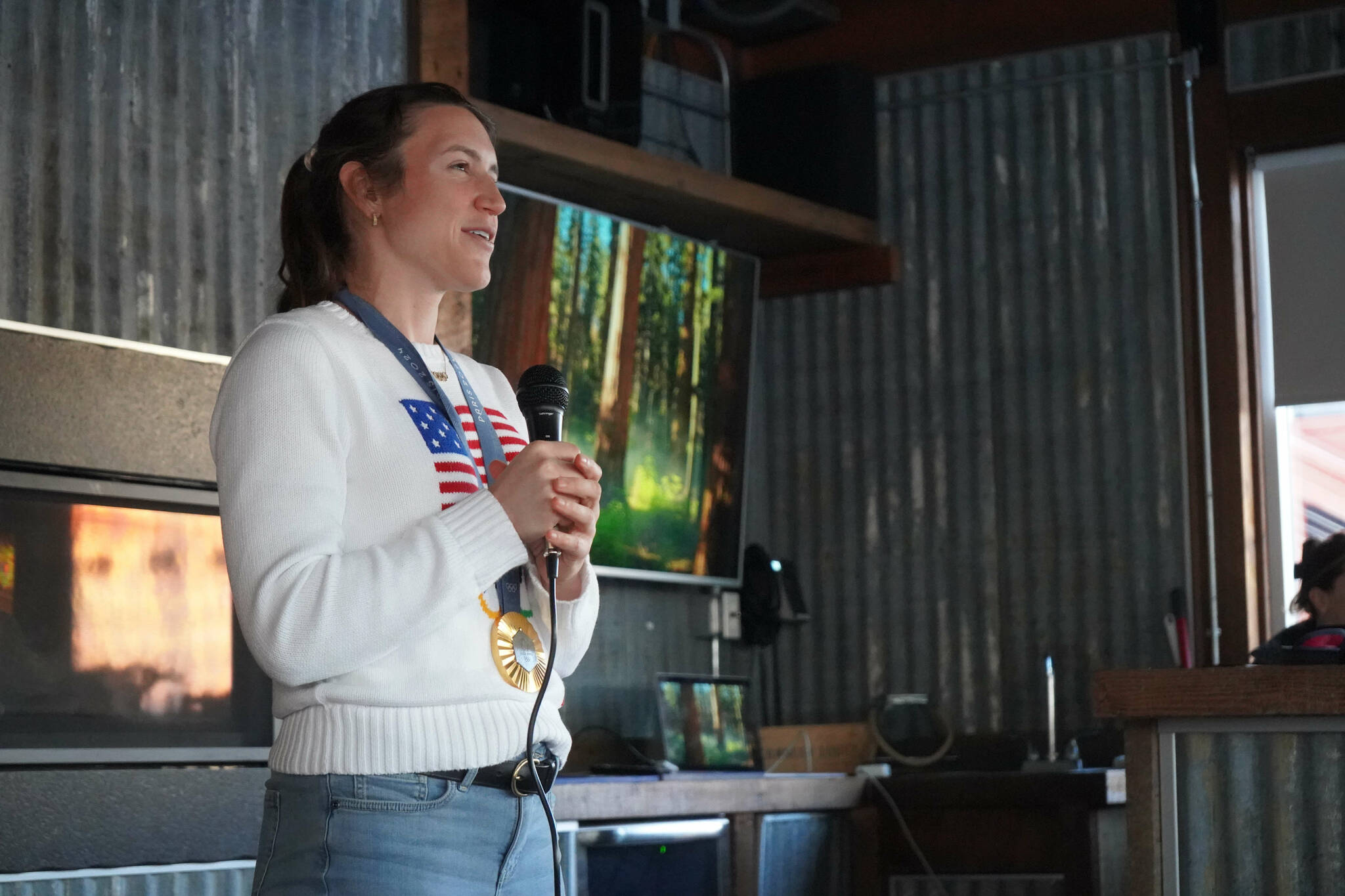 Kristen Faulkner, who won two gold medals for cycling at the Paris 2024 Olympics, speaks during a meet and greet hosted by the Kenai and Soldotna chambers of commerce at the Cannery Lodge in Kenai, Alaska, on Saturday, Dec. 28, 2024. (Jake Dye/Peninsula Clarion)