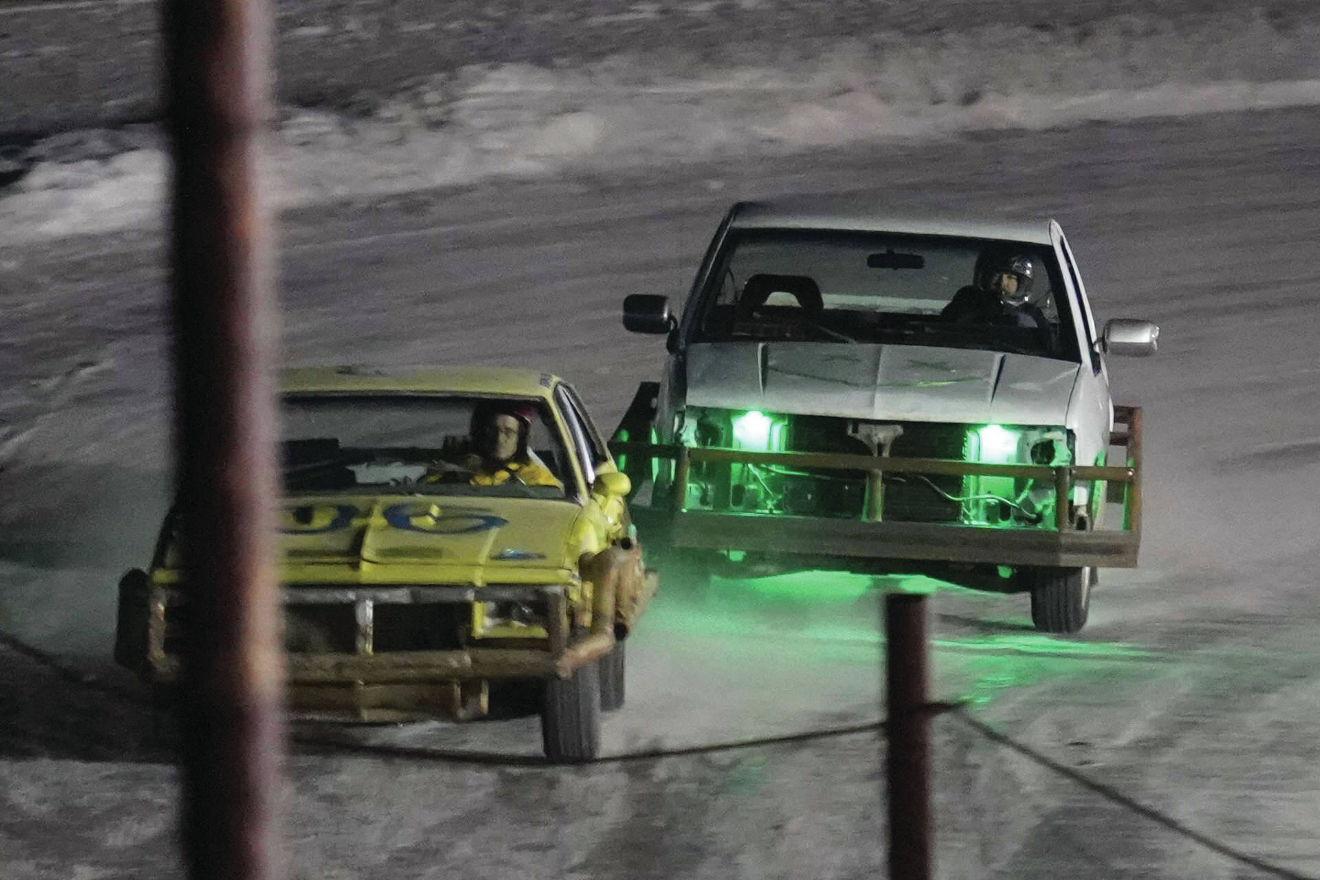 Racers vie for the lead in the second race of the Kenai Peninsula Ice Racing season at Twin City Raceway in Kenai on Tuesday. (Jake Dye/Peninsula Clarion)