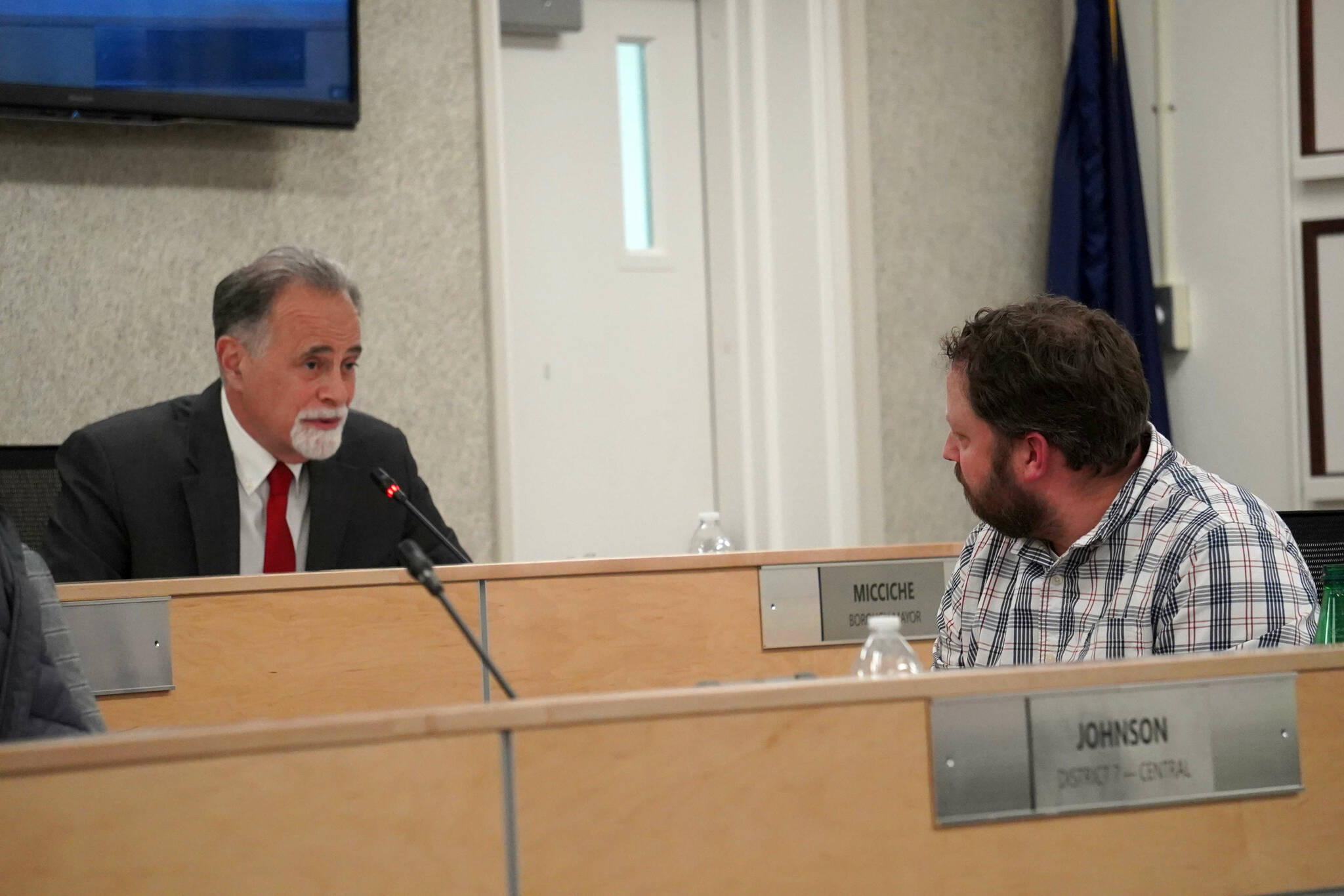 Kenai Peninsula Borough Mayor Peter Micciche offers well wishes to Bill Elam, who resigned from the borough assembly after being elected to the Alaska Legislature, during a meeting of the Kenai Peninsula Borough Assembly in Soldotna, Alaska, on Tuesday, Jan. 7, 2024. (Jake Dye/Peninsula Clarion)