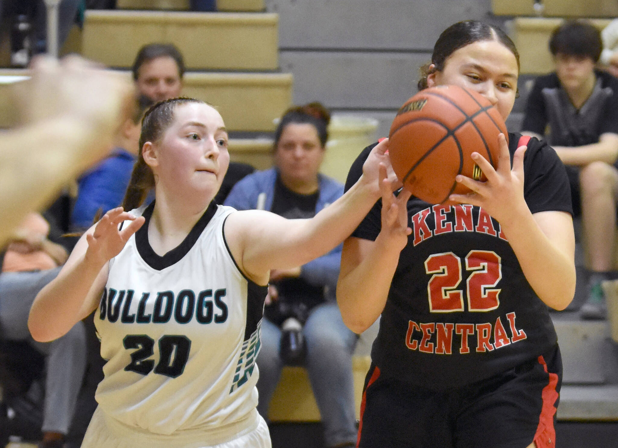 Kenai Central’s Bryleigh Williams tries to keep Nikiski’s Avery Ellis from stealing the ball Thursday, Jan. 9, 2025, at Nikiski Middle-High School in Nikiski, Alaska. (Photo by Jeff Helminiak/Peninsula Clarion)