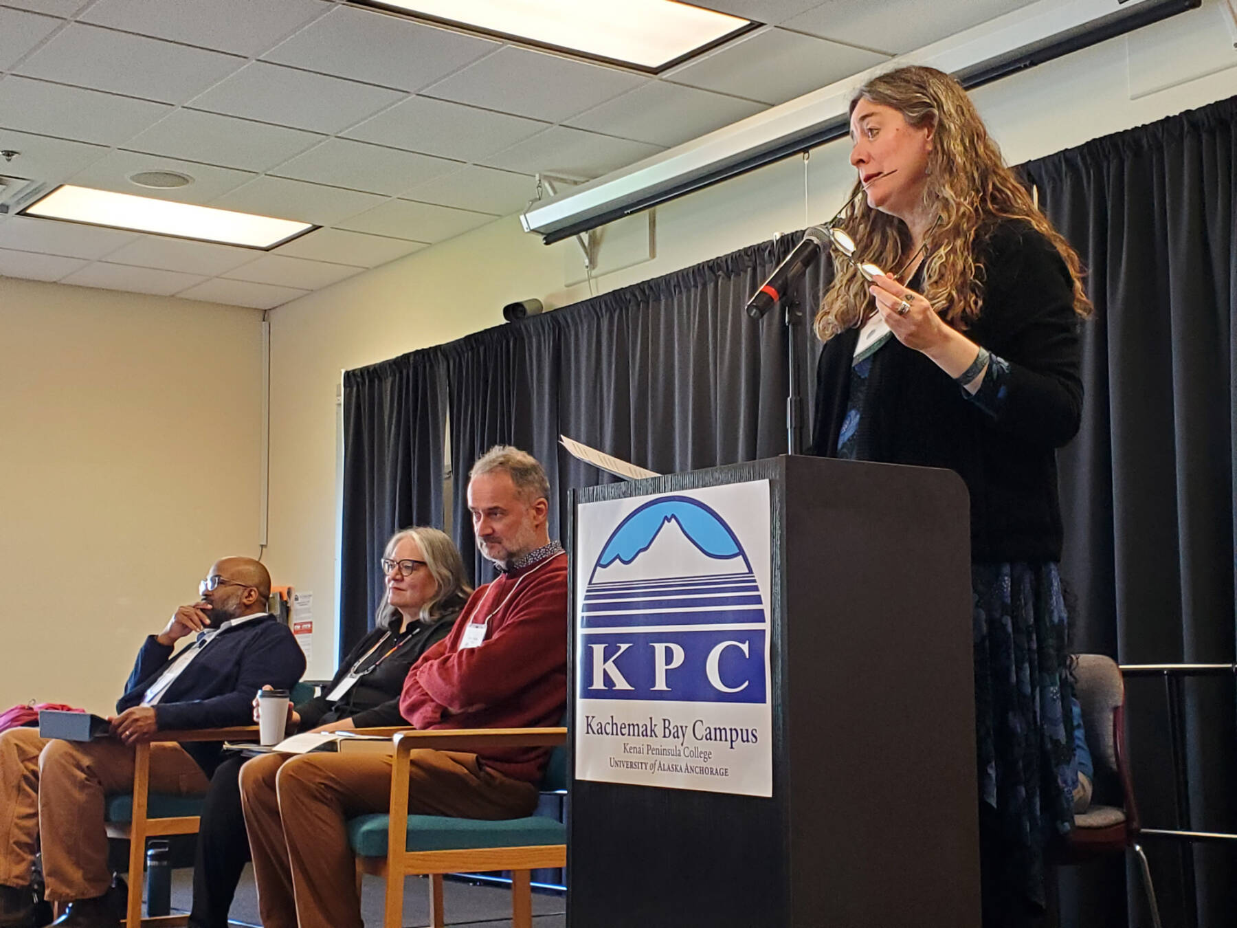 Kachemak Bay Writers’ Conference director Erin Coughlin Hollowell (right) welcomes attendees to the opening panel on Saturday, May 18, 2024 at Kachemak Bay Campus in Homer, Alaska. (Delcenia Cosman/Homer News)