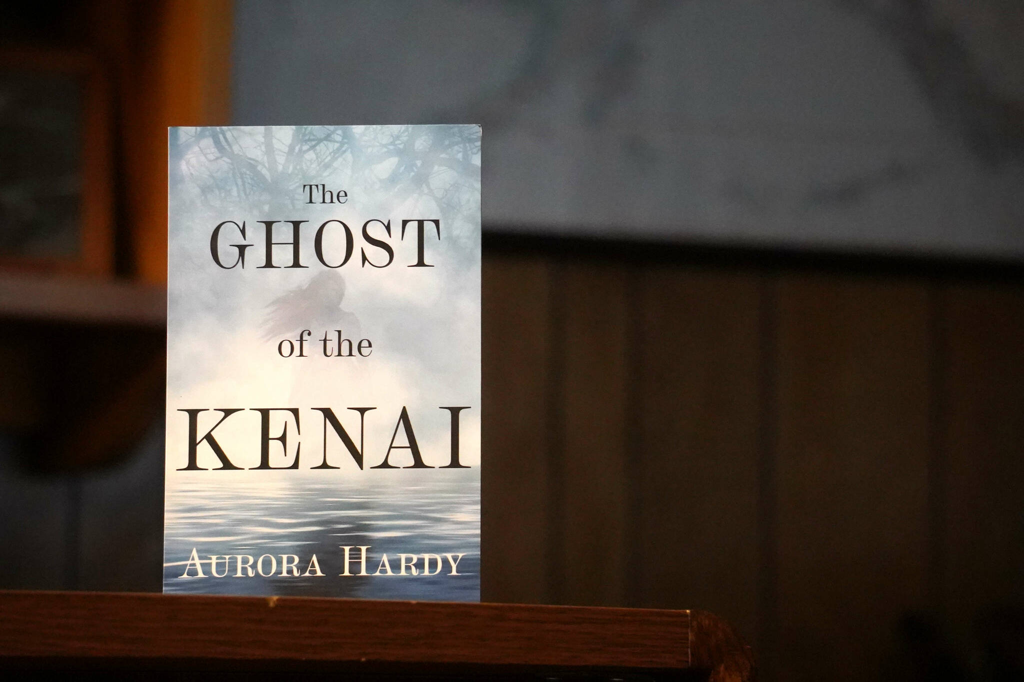 A copy of “The Ghost of the Kenai” stands on a desk in the Peninsula Clarion newsroom in Kenai, Alaska, on Tuesday, Jan. 21, 2025. (Jake Dye/Peninsula Clarion)