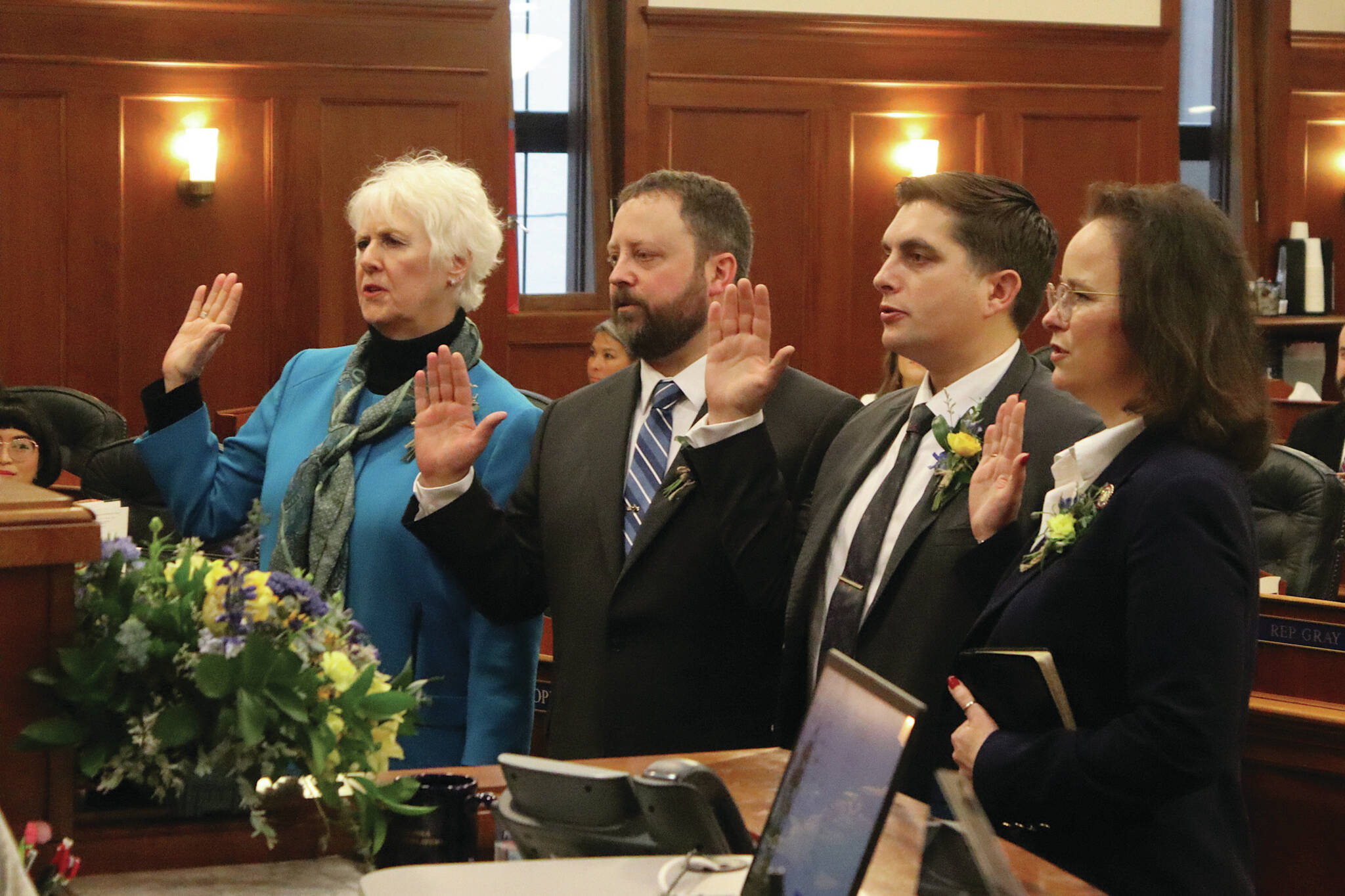 From left: Alaska House Reps. Louise Stutes, R-Kodiak; Bill Elam, R-Nikiski; Justin Ruffridge, R-Soldotna; and Sarah Vance, R-Homer, take the oath of office at the Alaska Capitol on Tuesday in Juneau. (Photo by Mark Sabbatini/Juneau Empire)